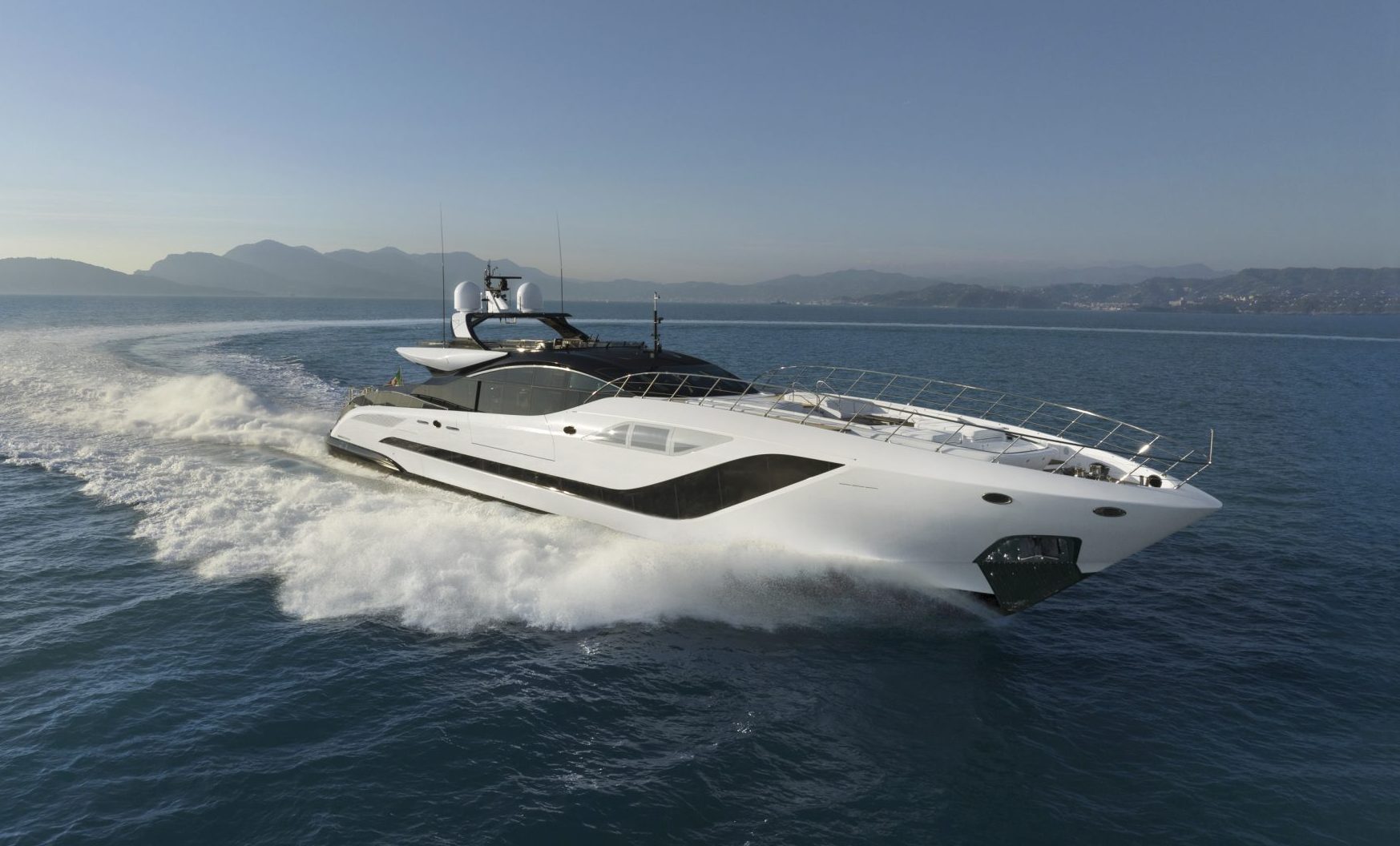 Luxurious Mangusta yacht cruising in open waters