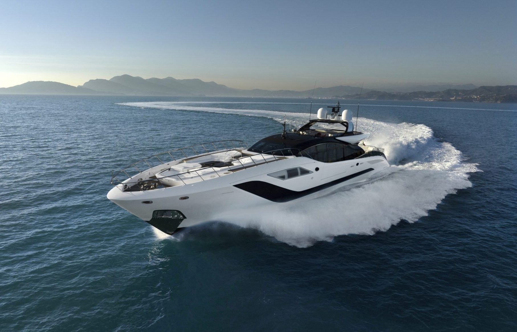 Mangusta luxury yacht cruising on open sea.