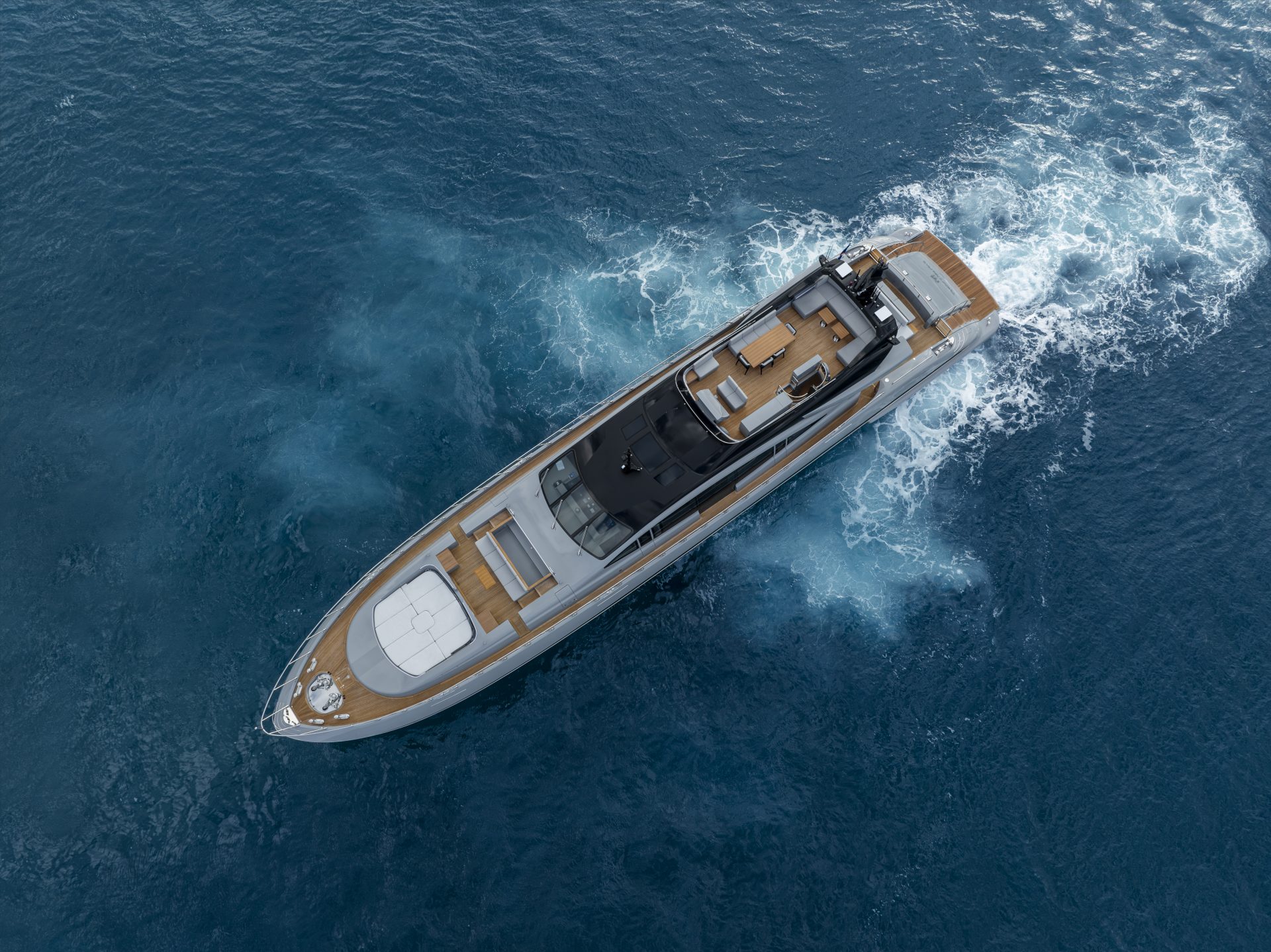 Mangusta yacht cruising through blue ocean waters.