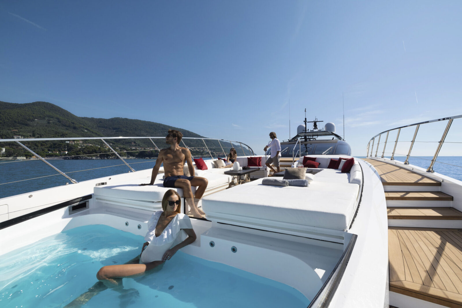 Sunbathing on Mangusta yacht deck with pool