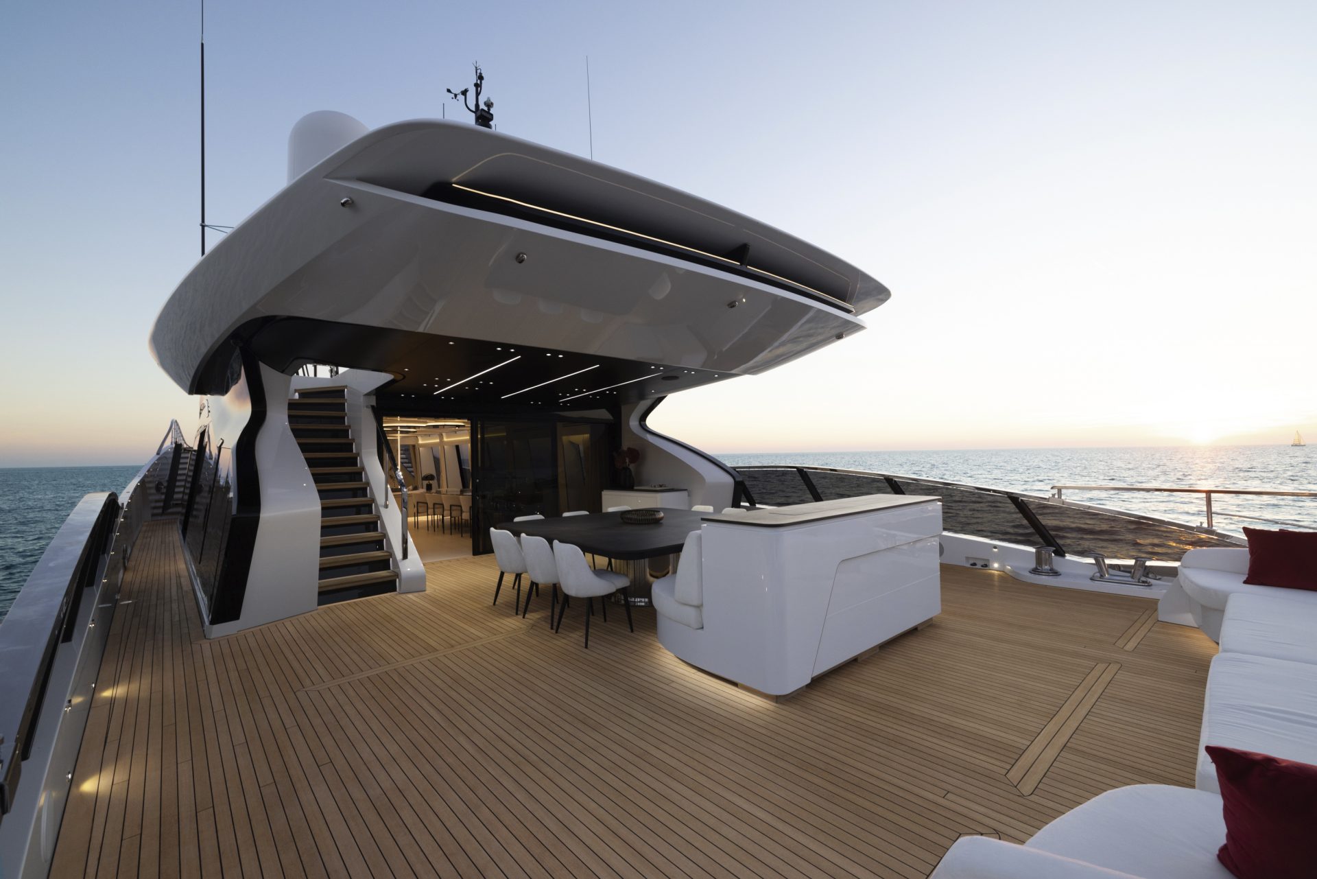 Luxurious yacht deck at sunset, Mangusta Yachts.
