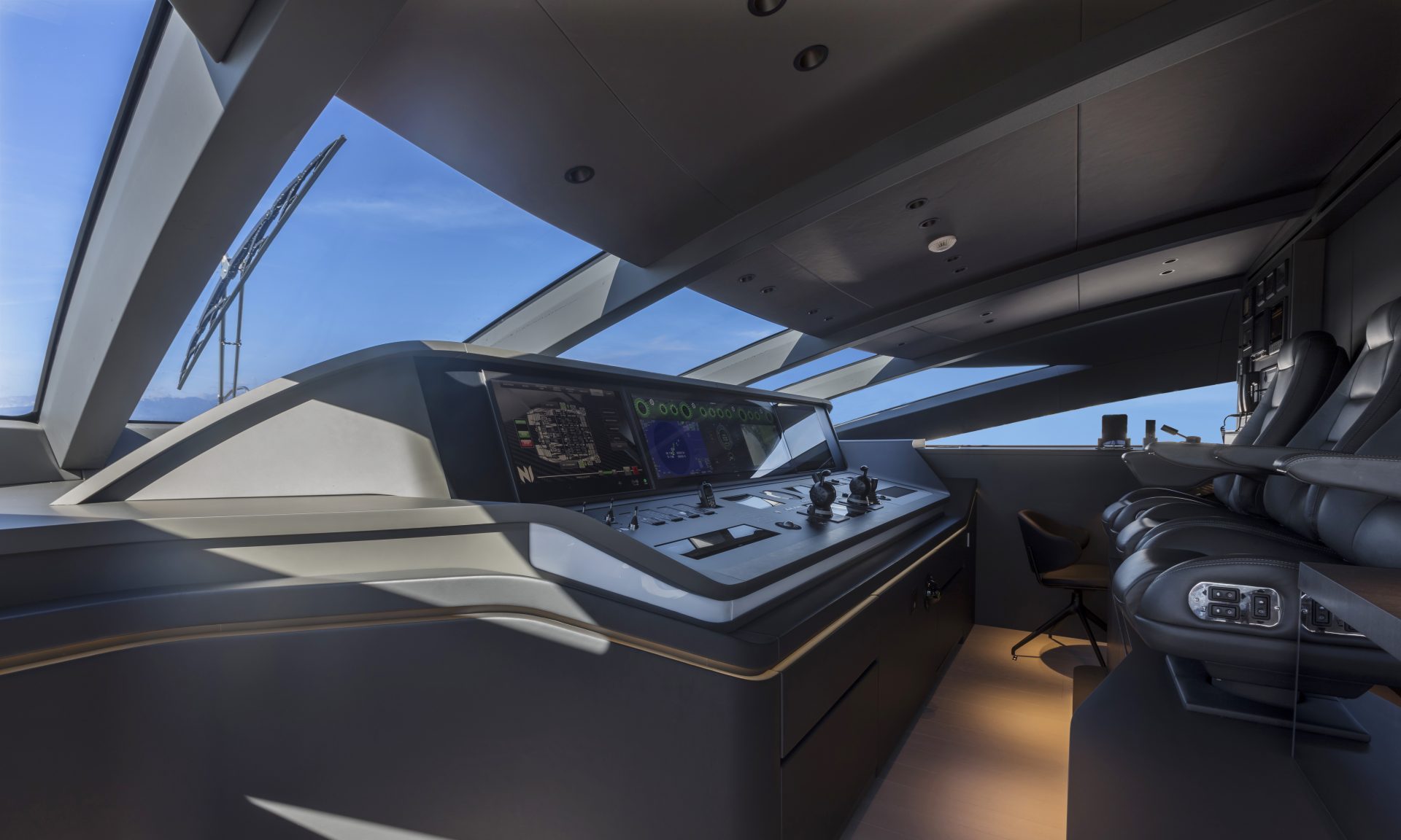 Modern helm station onboard Mangusta yacht.