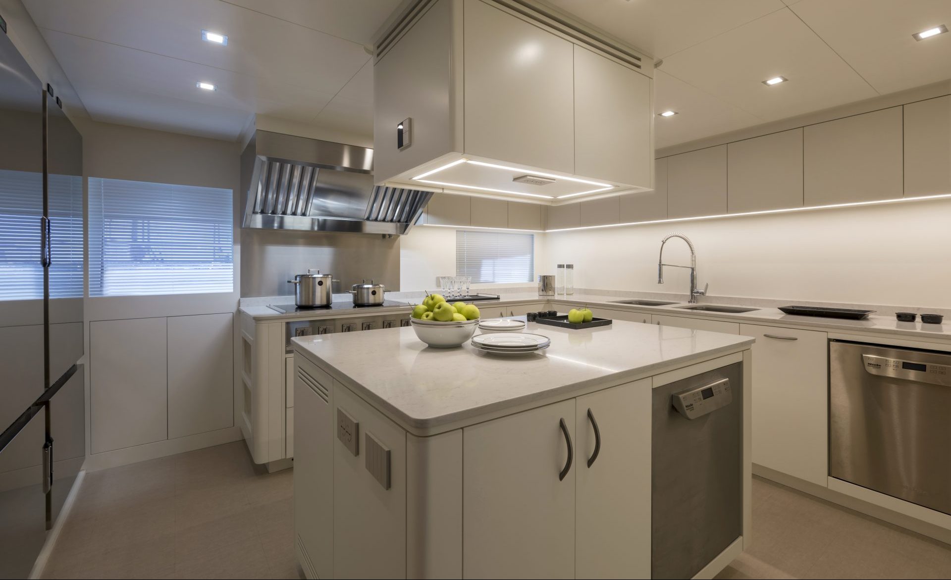 Luxurious yacht kitchen with modern appliances.