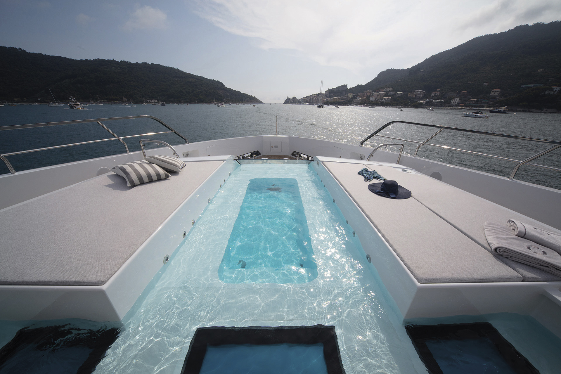 Luxury yacht deck with sunbed and pool view