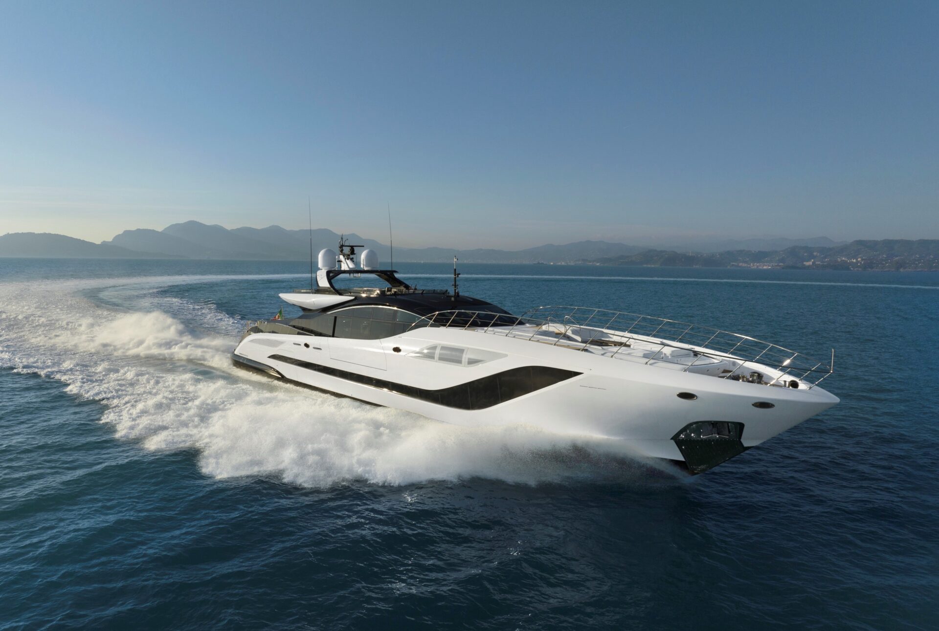Mangusta yacht cruising in open sea.