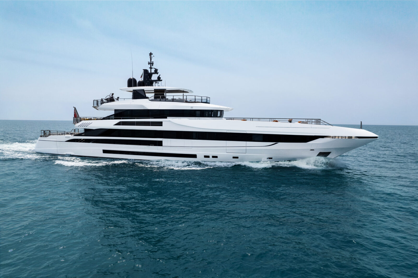 Luxury Mangusta yacht cruising on blue sea