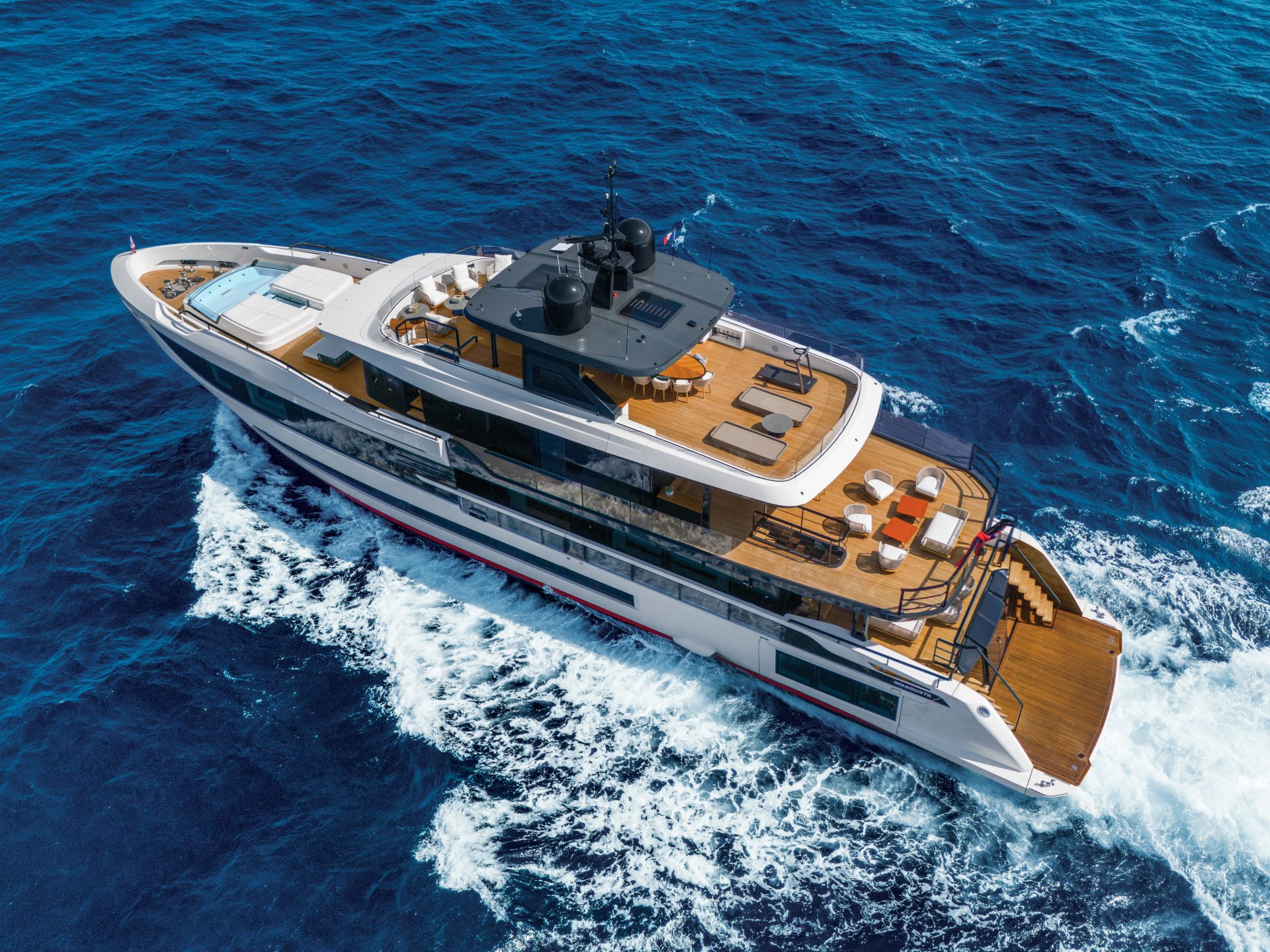 Mangusta Yacht cruising in blue ocean.