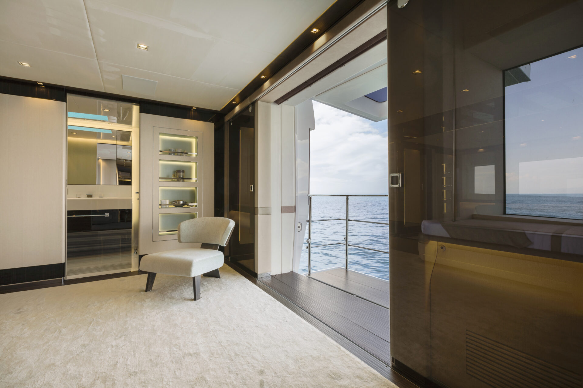 Yacht interior with ocean view balcony.