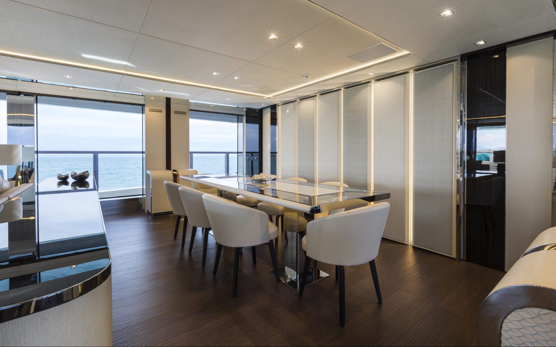 Luxury yacht dining room with ocean view.