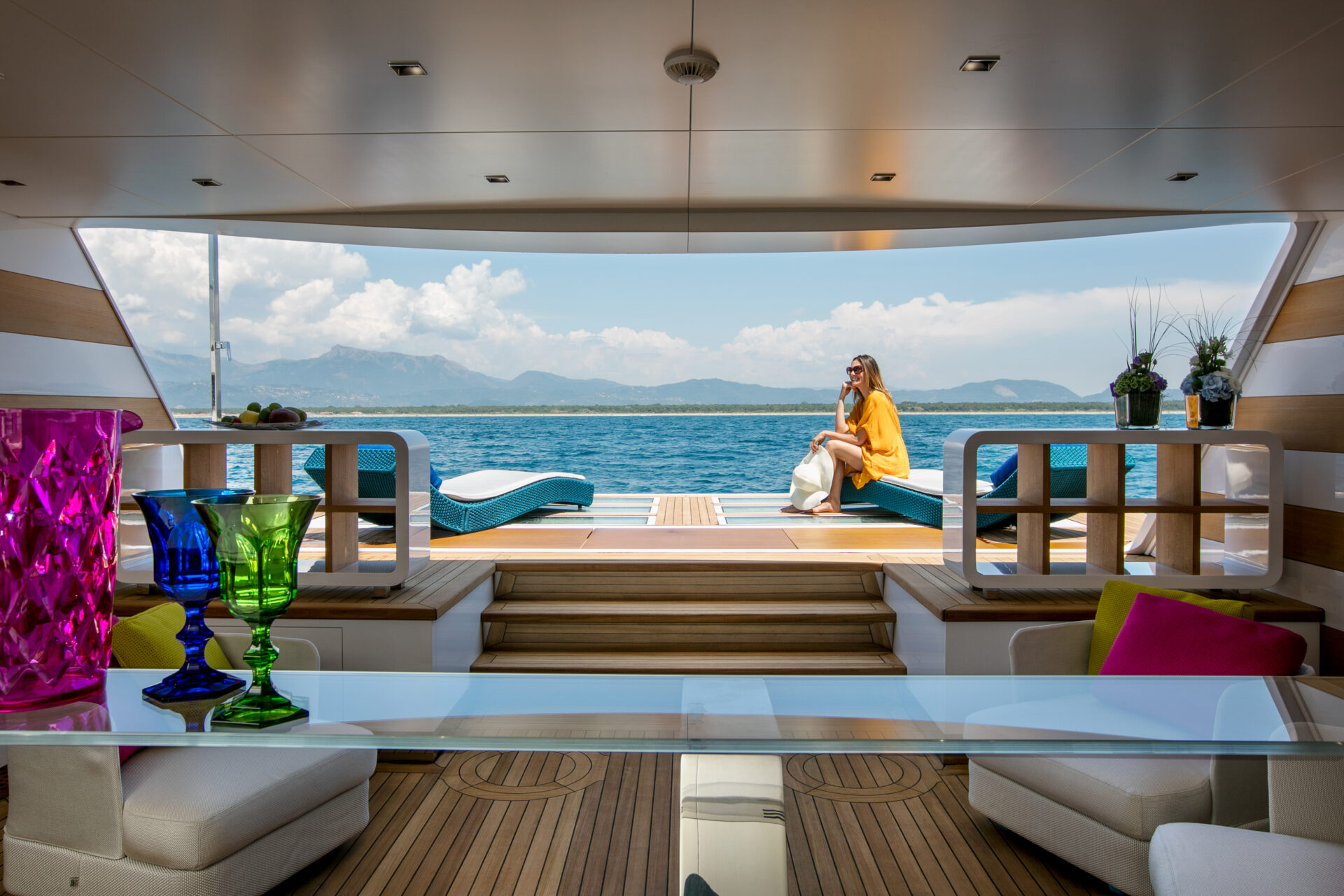 Luxurious yacht deck with sea view and seating.