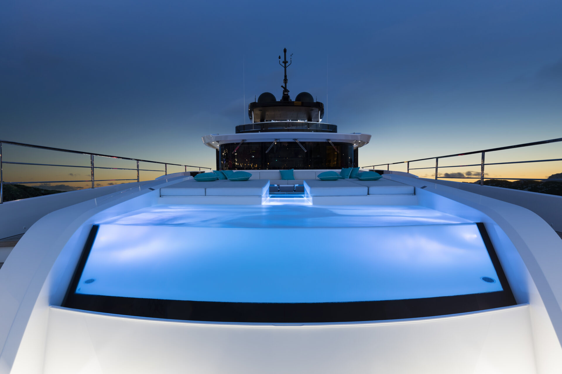 Luxury yacht pool at sunset.