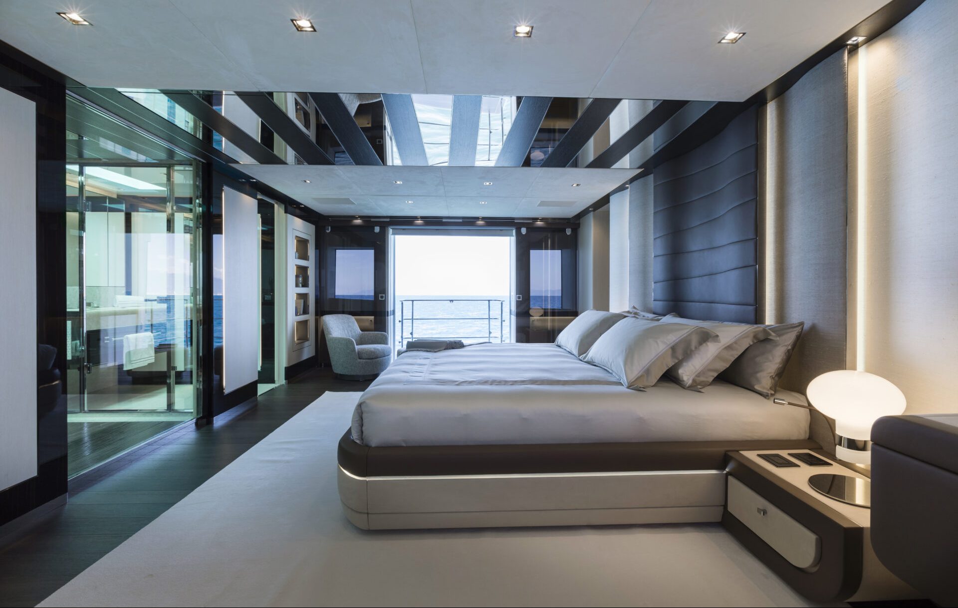 Luxurious yacht bedroom with ocean view.