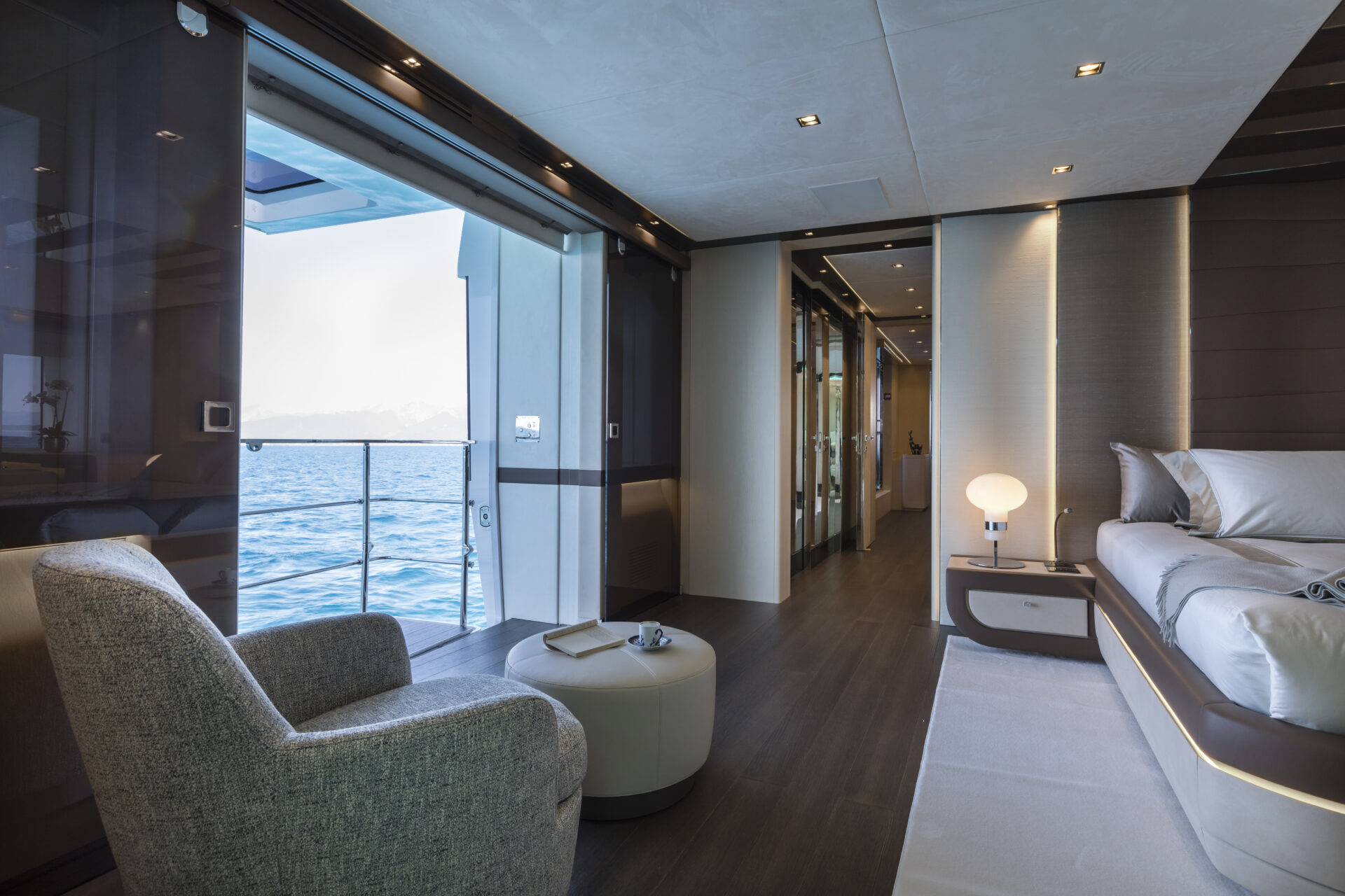 Luxurious yacht bedroom with ocean view.