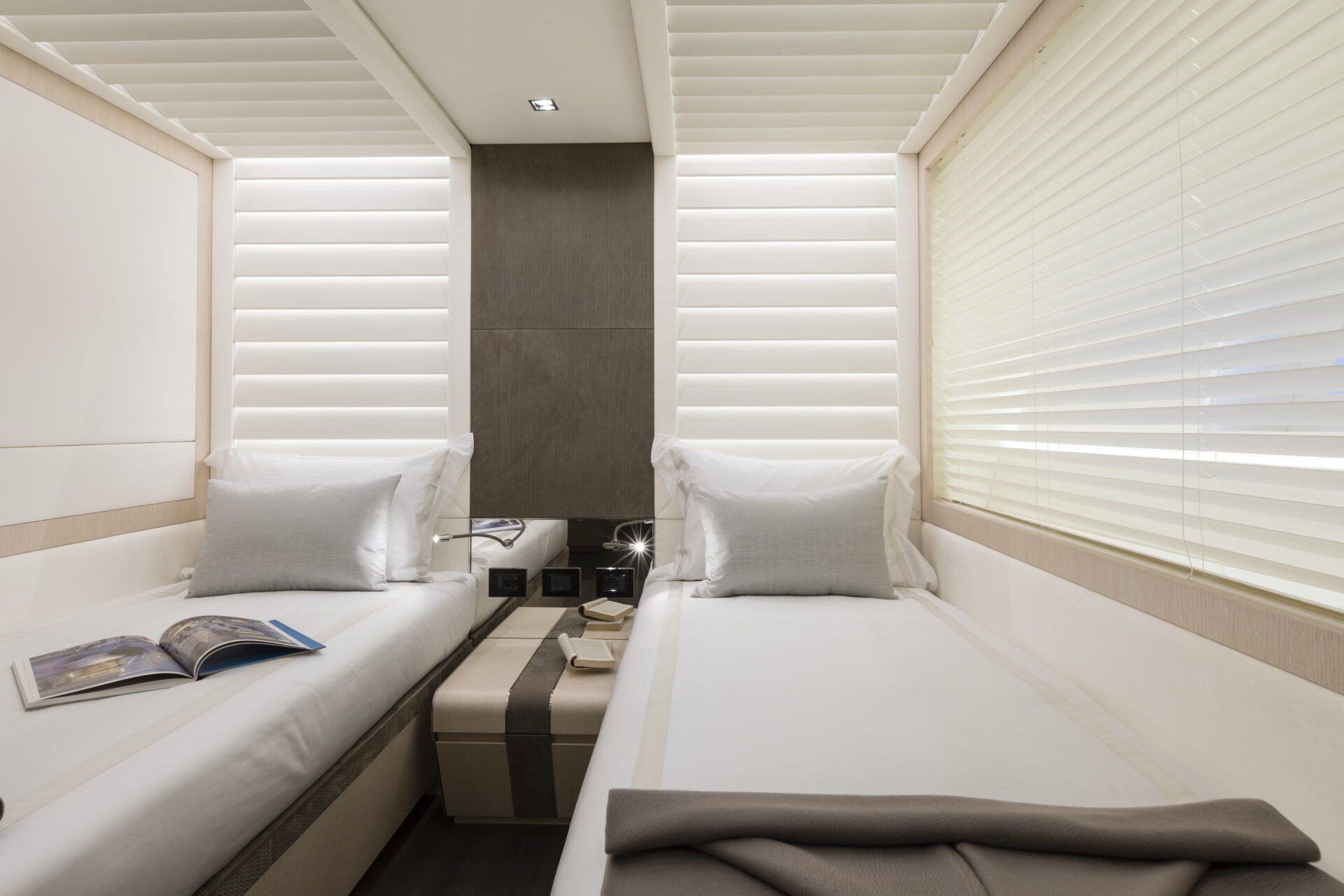 Luxurious twin cabin interior on Mangusta yacht.
