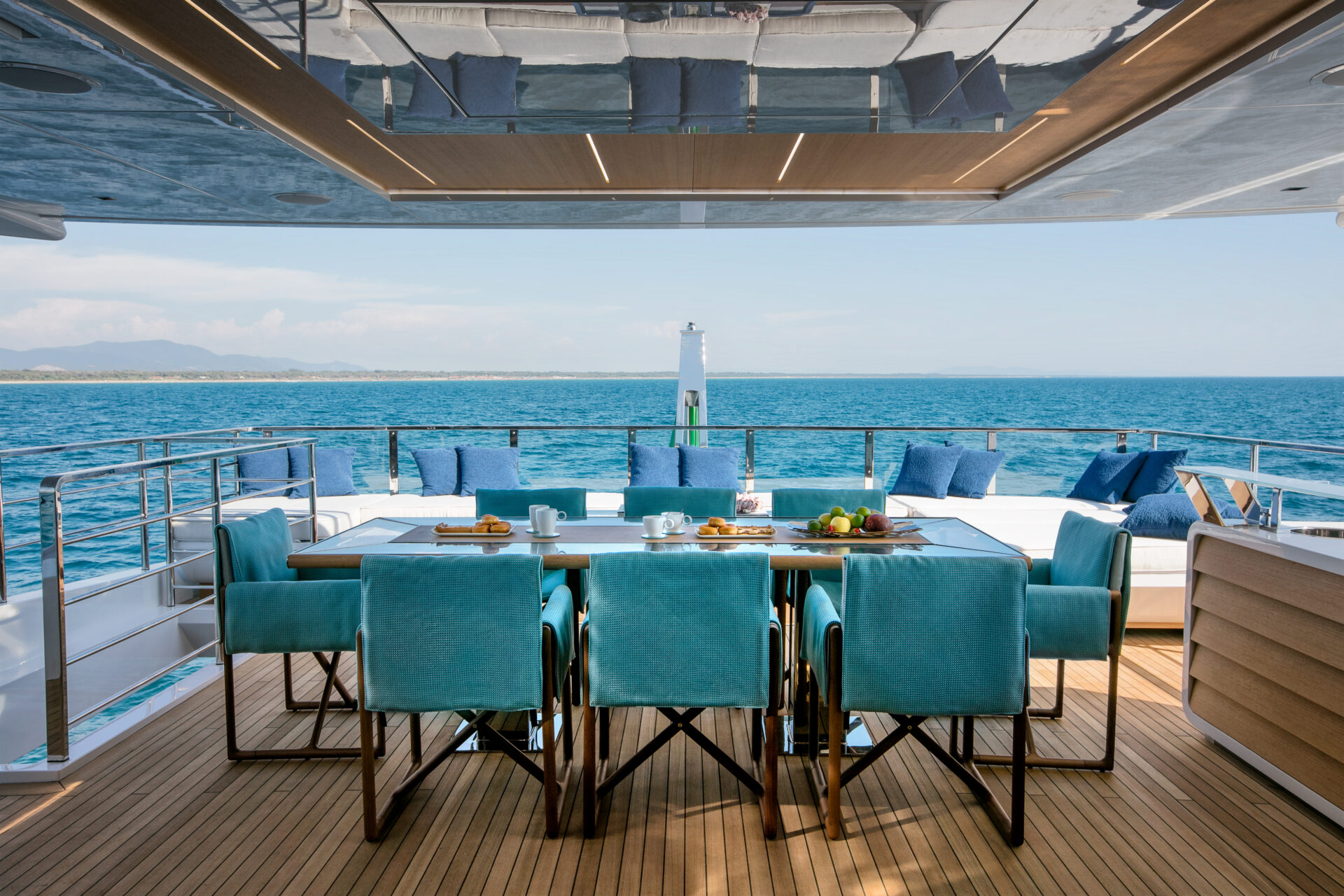 Deck dining area on Mangusta Yacht.