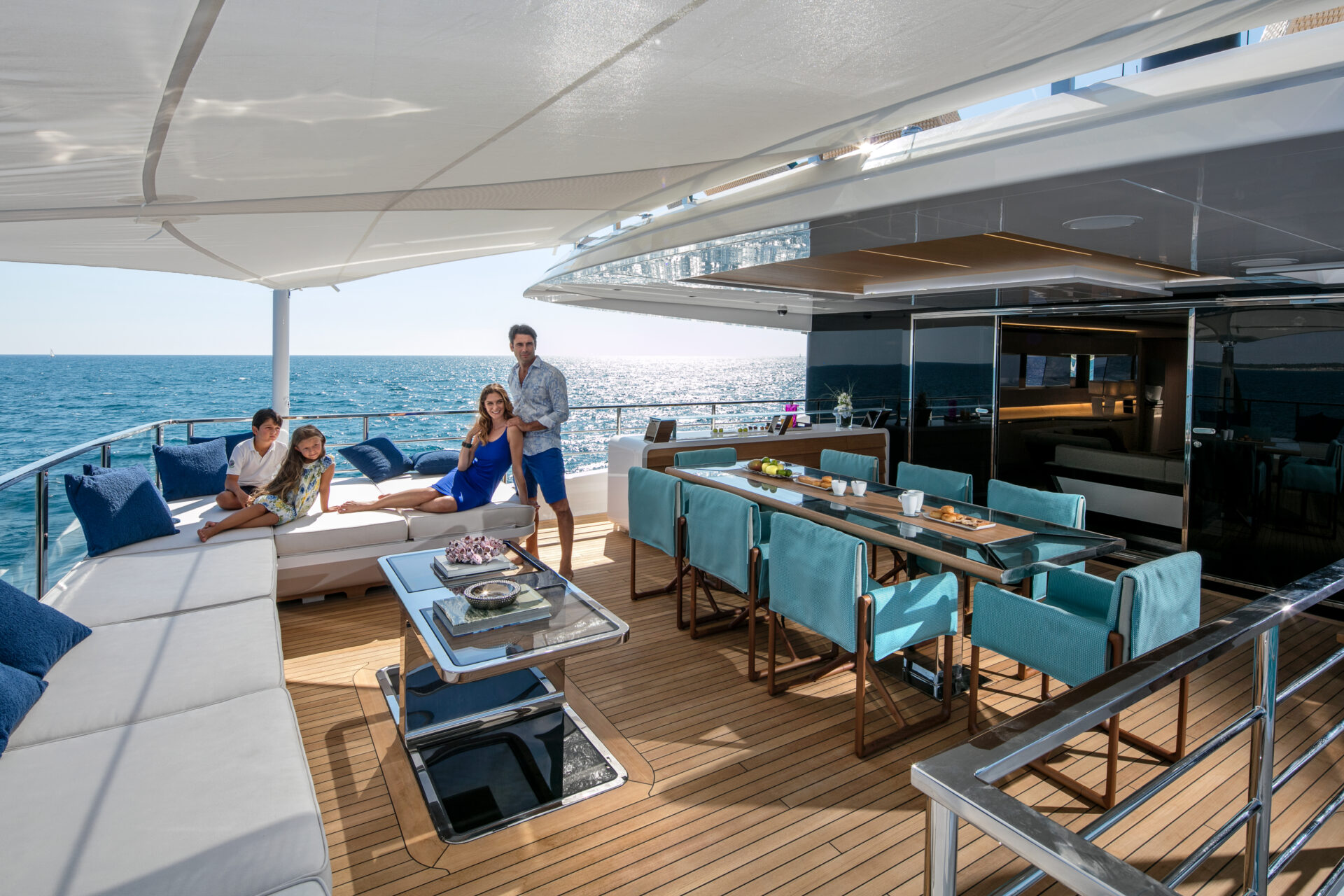 Luxurious Mangusta Yachts deck with family lounging