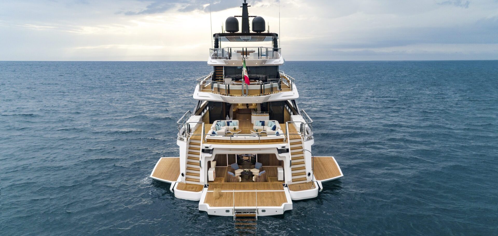 Luxury Mangusta yacht cruising the ocean.