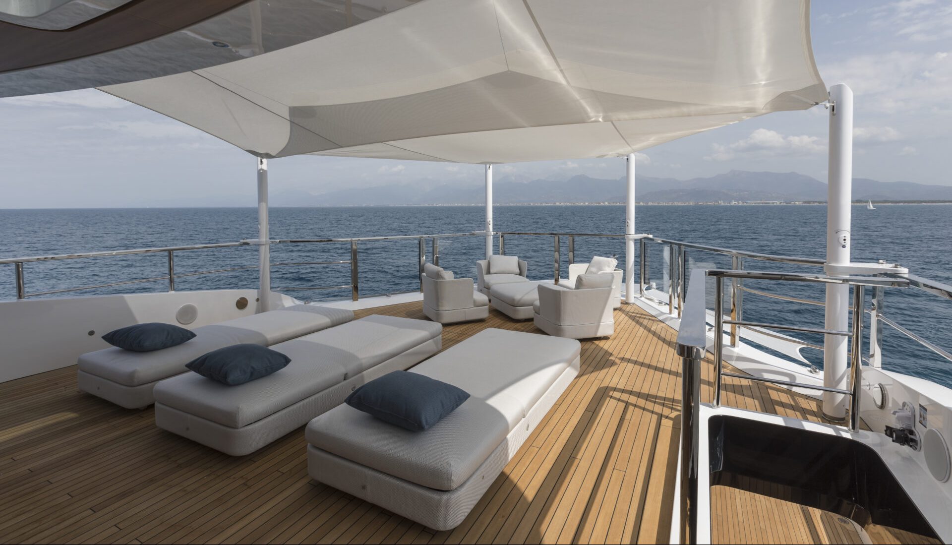 Luxury sun deck on Mangusta yacht with ocean view