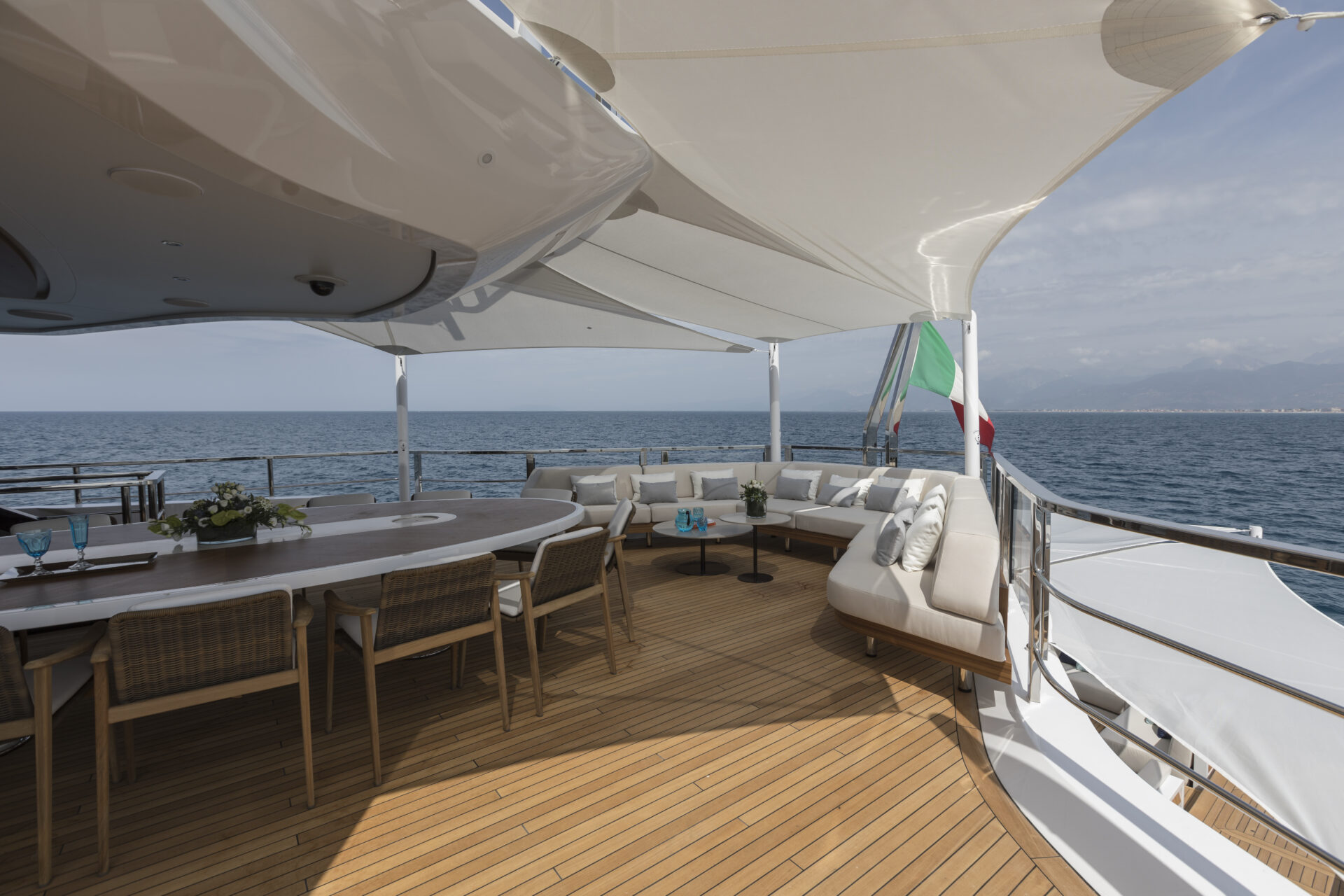 Elegant yacht deck with dining area and ocean view