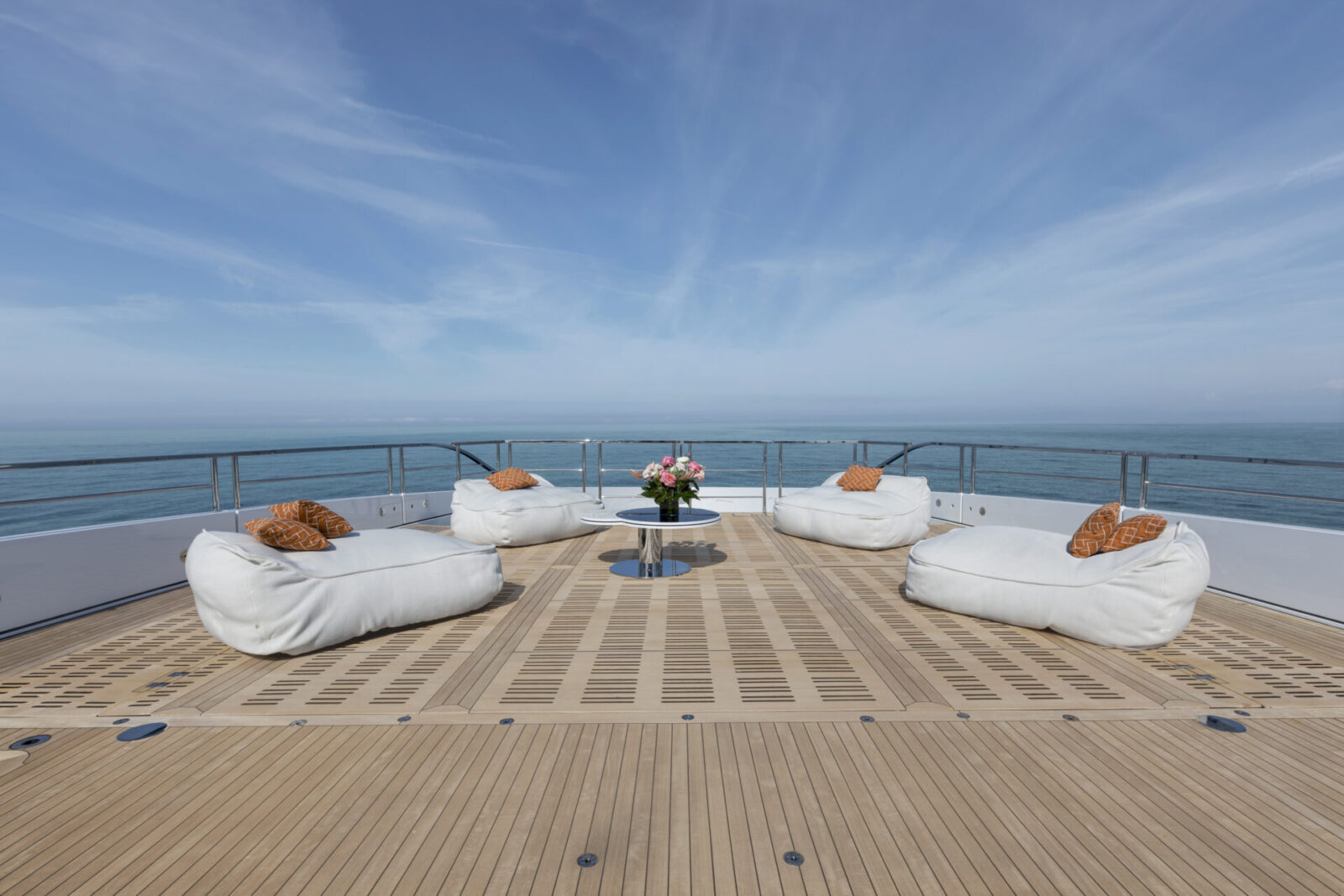 Elegant yacht deck with plush seating area.
