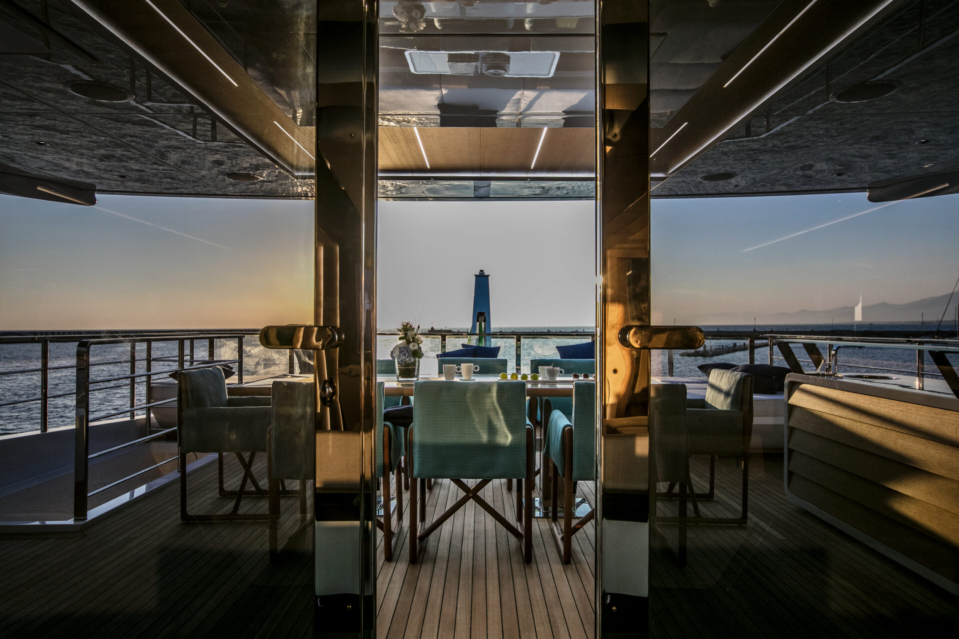 Luxury yacht dining area at sunset.