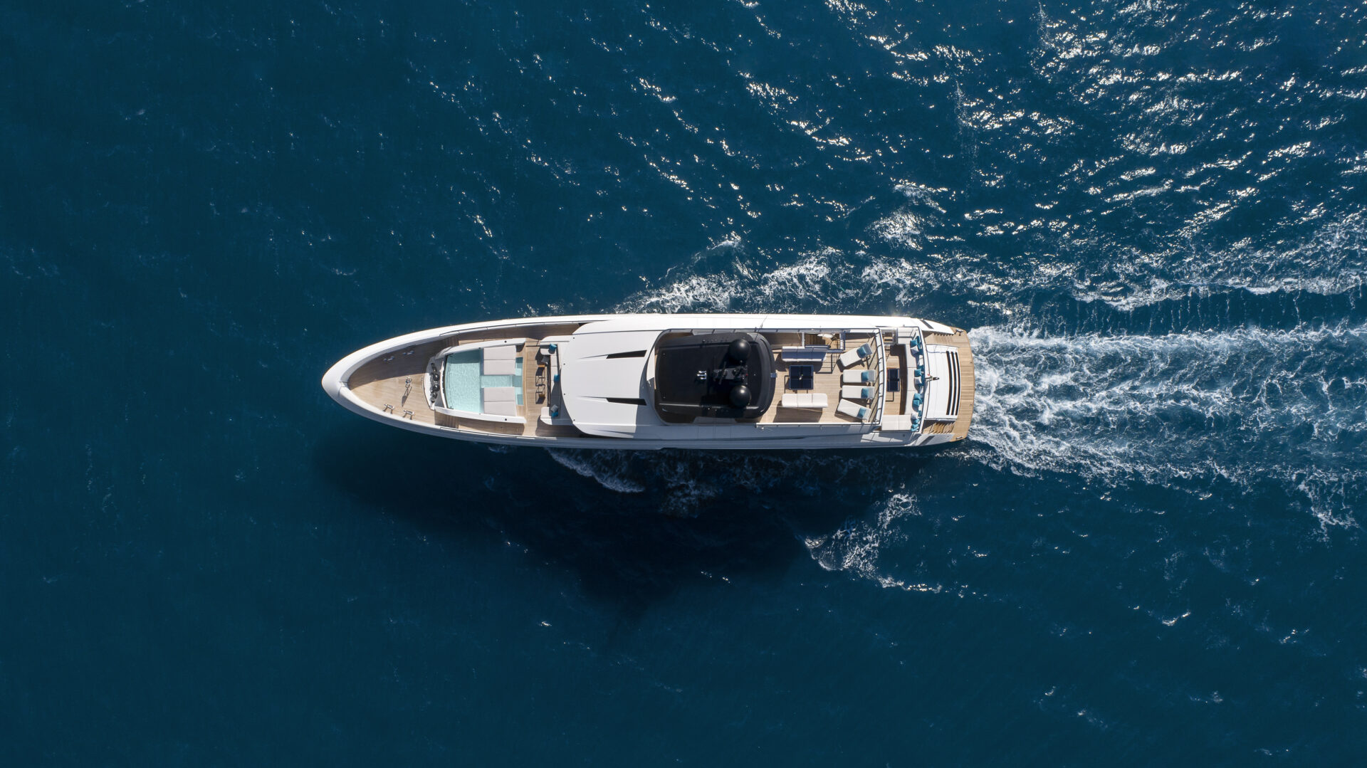 Mangusta yacht cruising in open sea, aerial view
