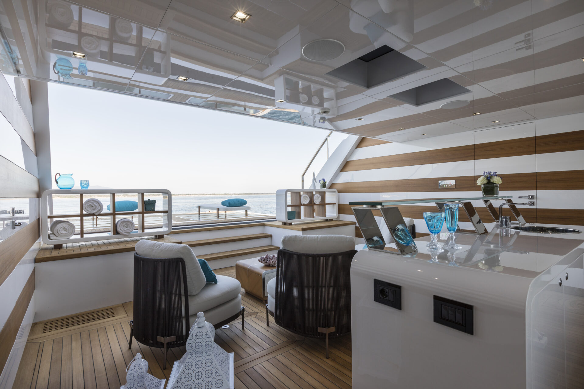 Luxurious Mangusta Yachts deck with seating area.