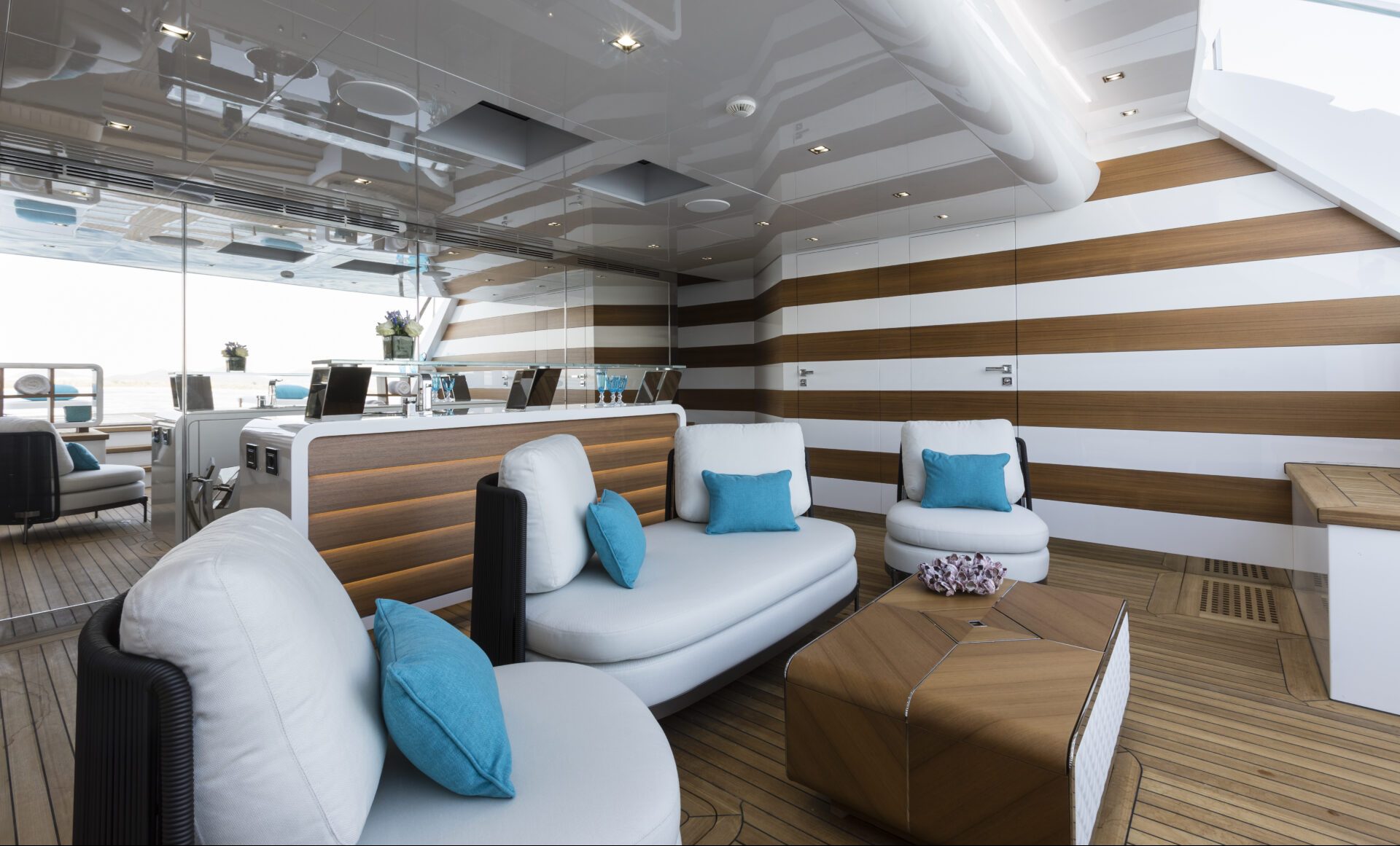 Luxurious yacht lounge with modern decor.