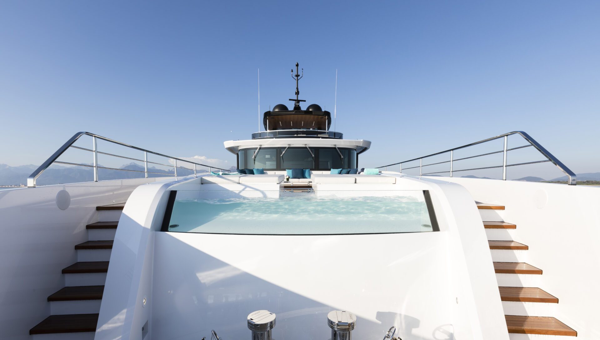 Luxury Mangusta yacht deck with Jacuzzi view.