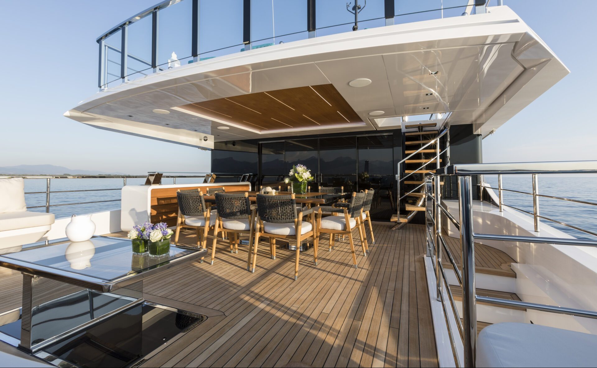 Luxury yacht deck with dining area at sea