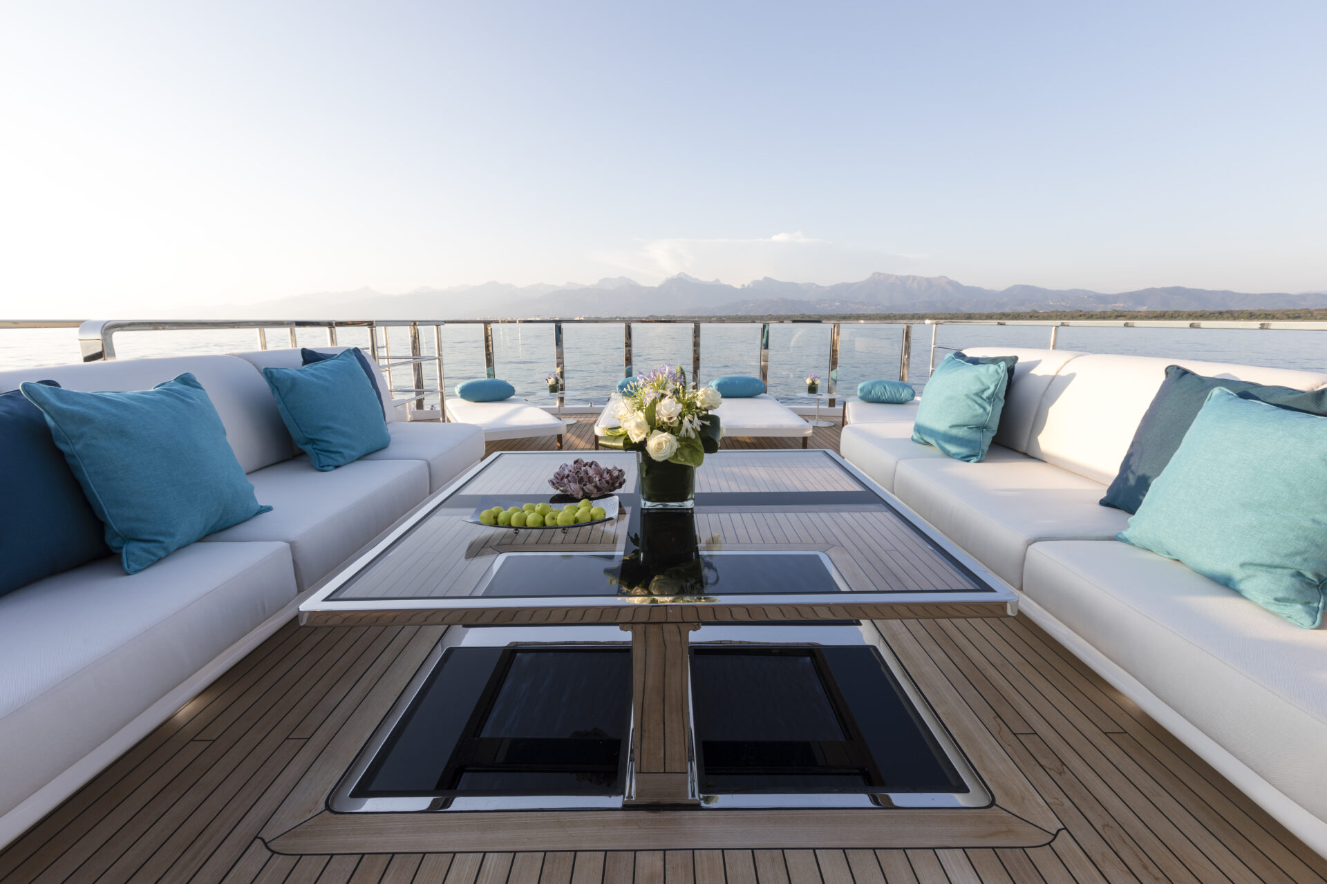 Luxurious yacht deck with sofas and sea view