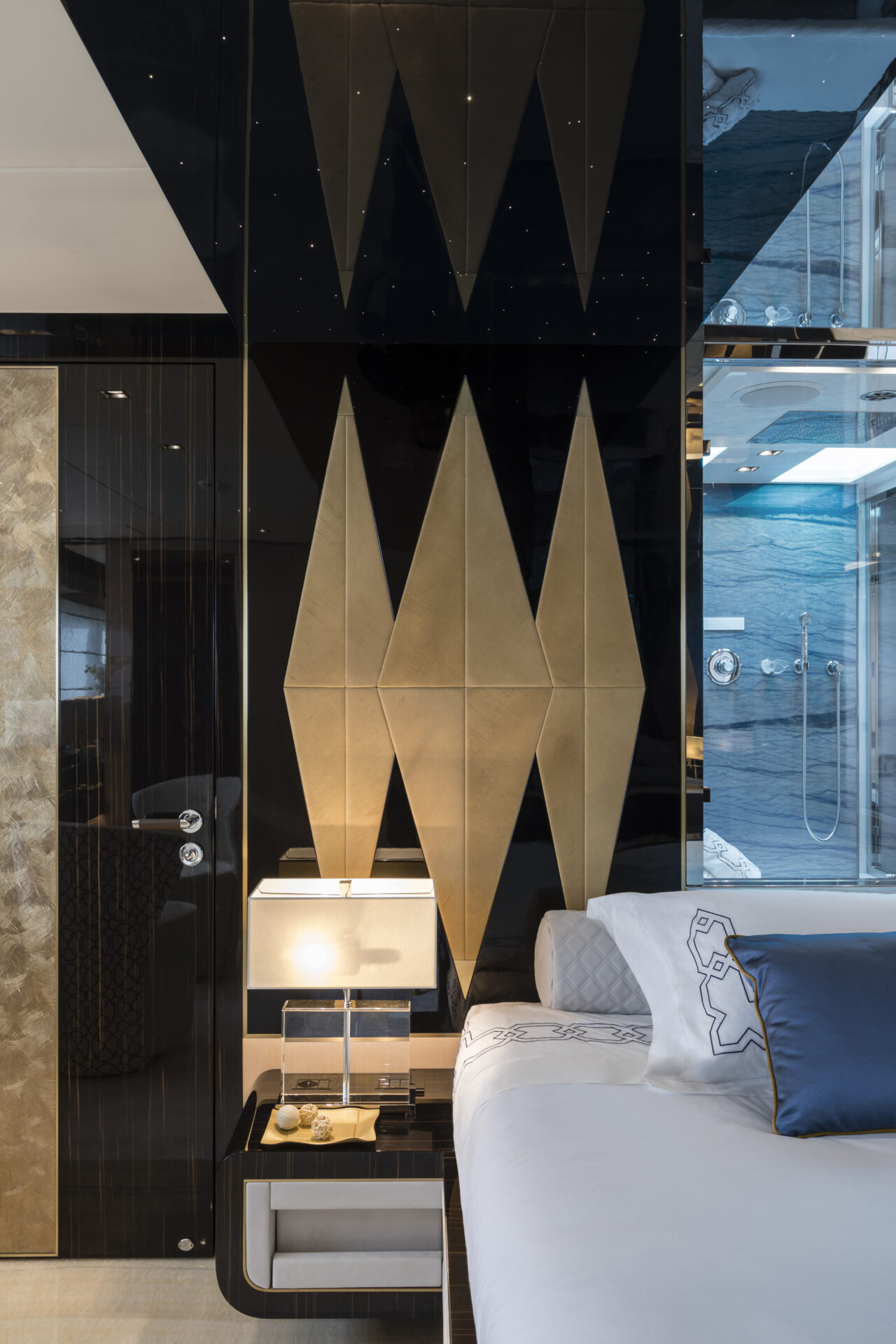 Elegant yacht bedroom with geometric wall design.