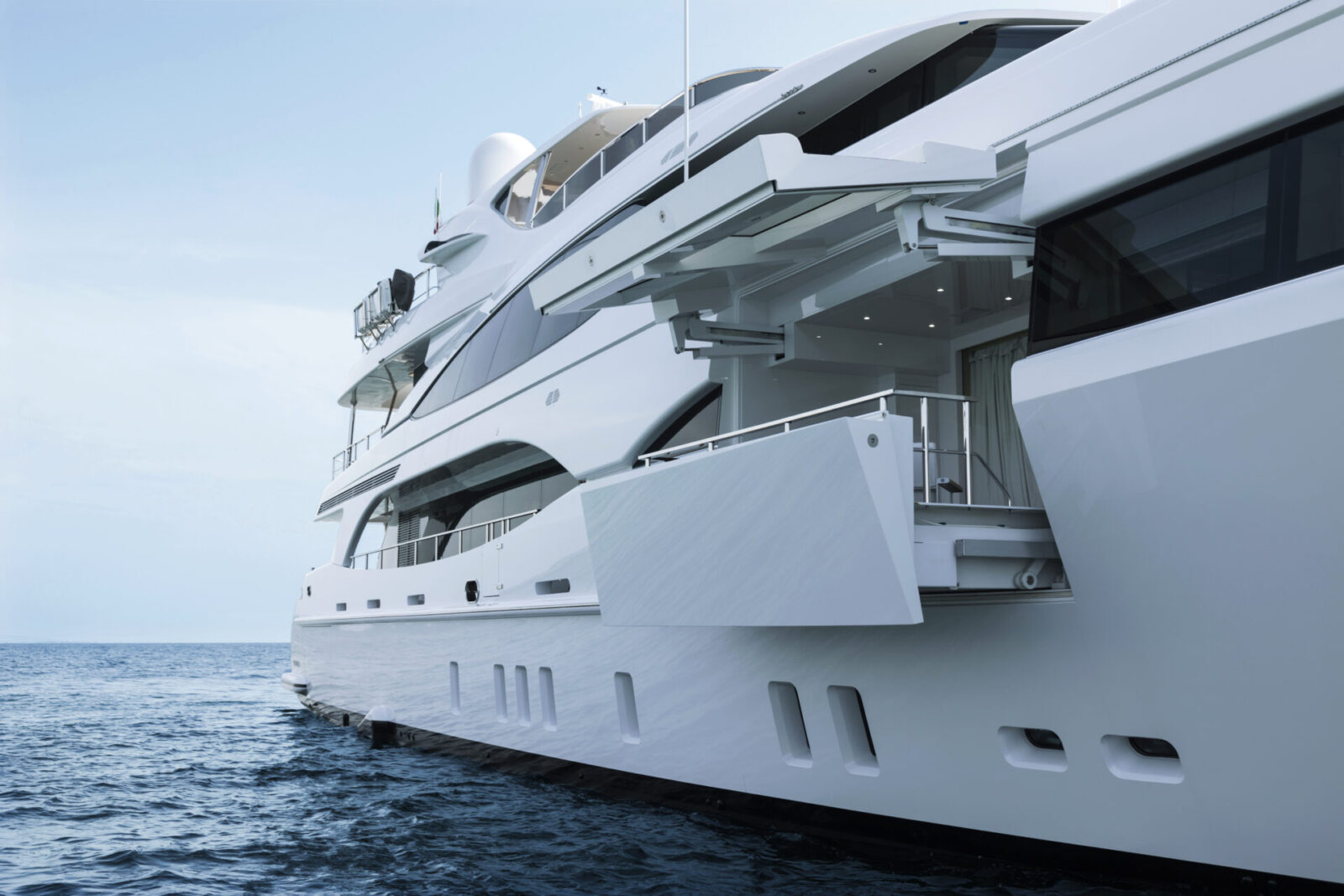 Luxury Mangusta Yacht on serene water.