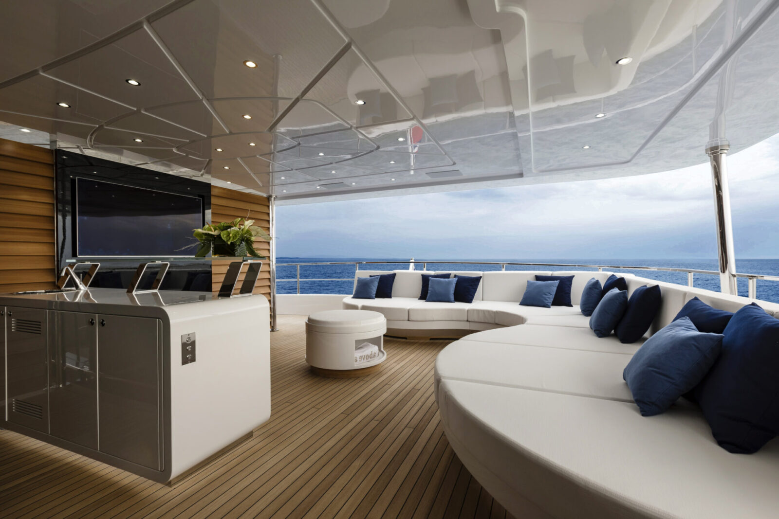 Luxurious Mangusta yacht deck with ocean view.