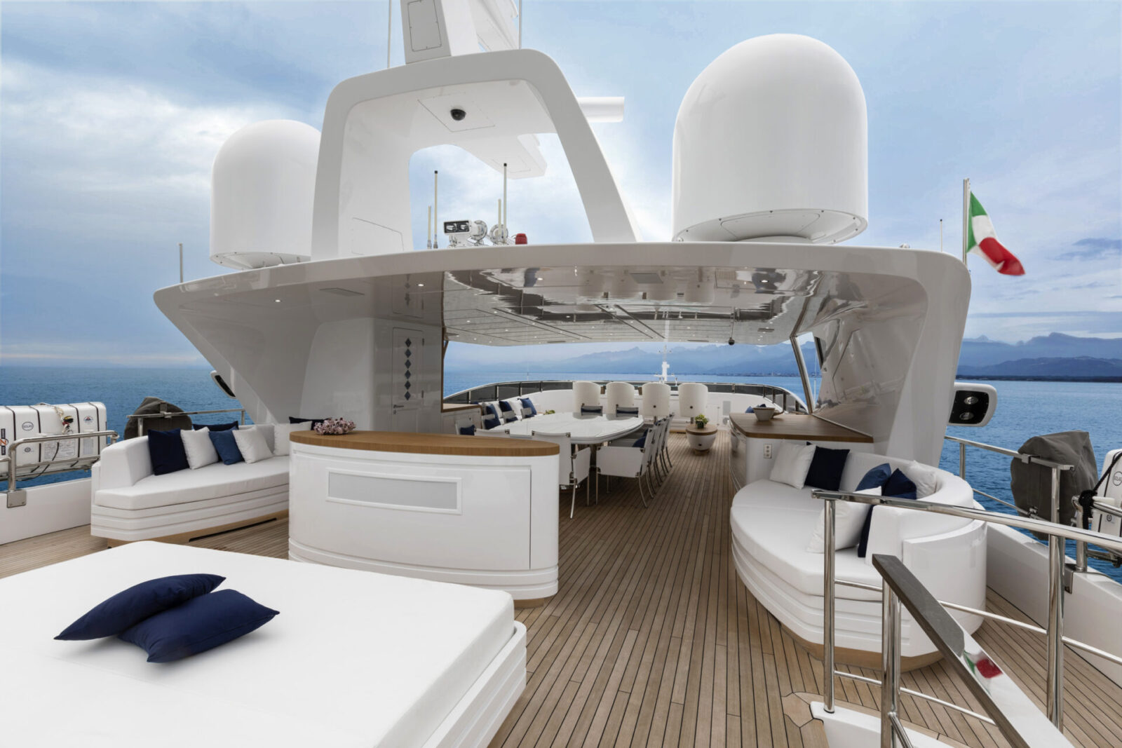 Italian flag on luxurious yacht deck, ocean view
