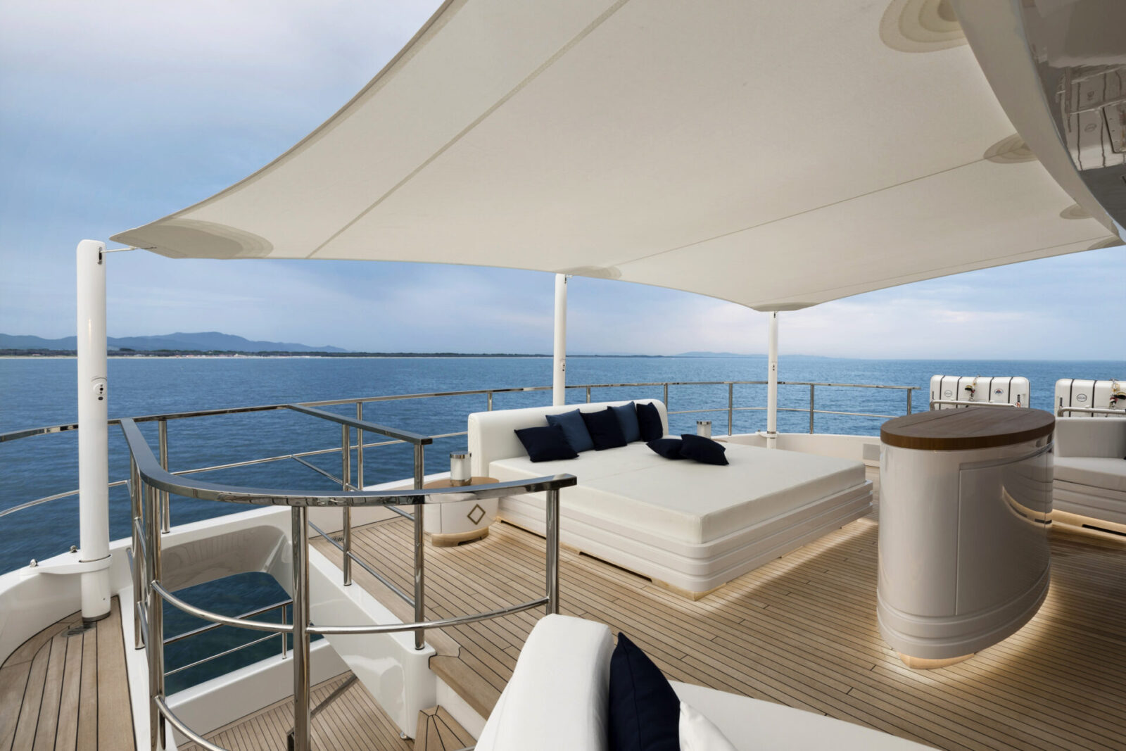 Luxurious deck of Mangusta yacht with ocean view.