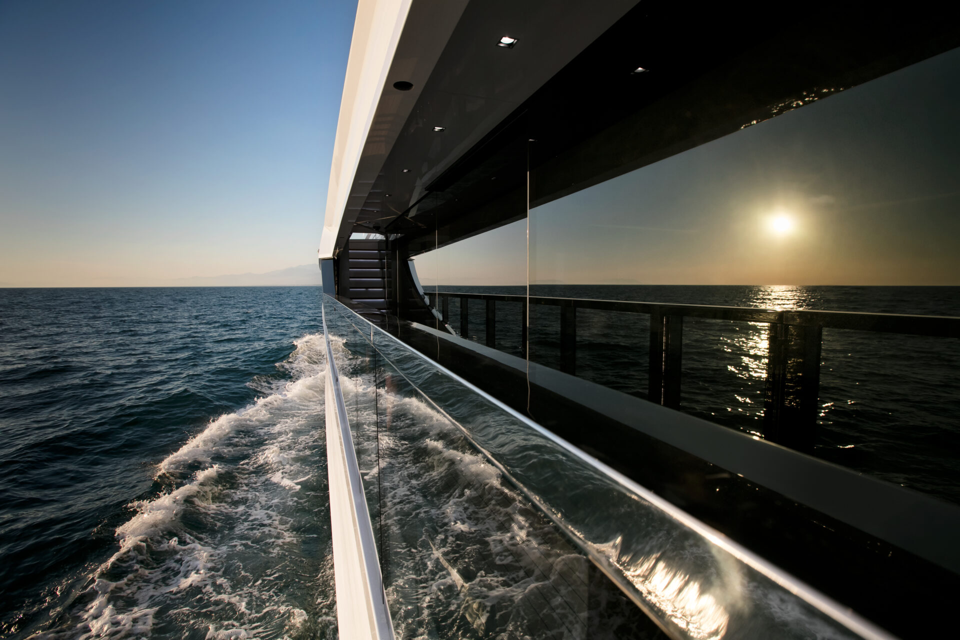 Luxury yacht cruising at sunset ocean view