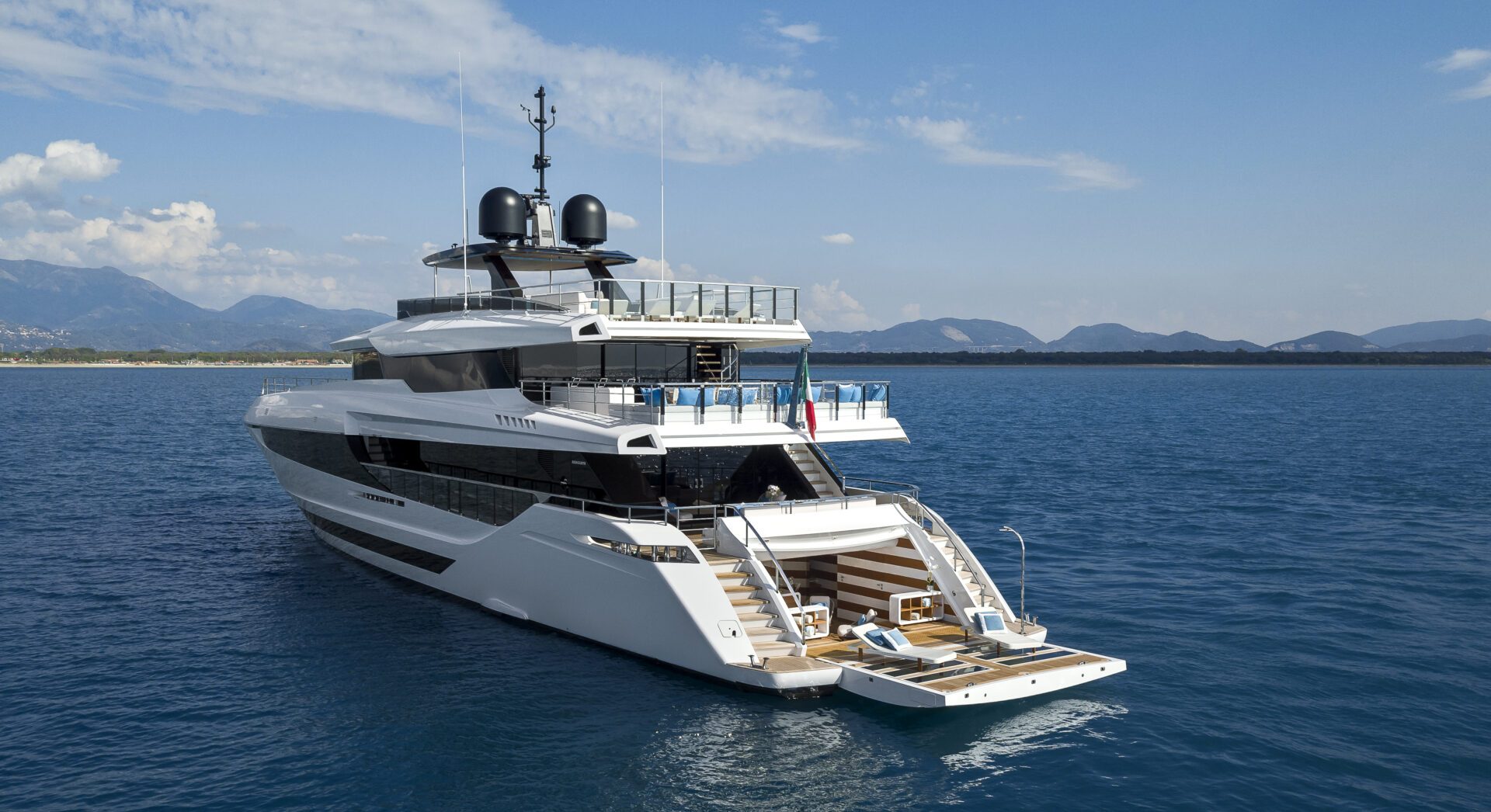 Luxurious Mangusta yacht on open sea.