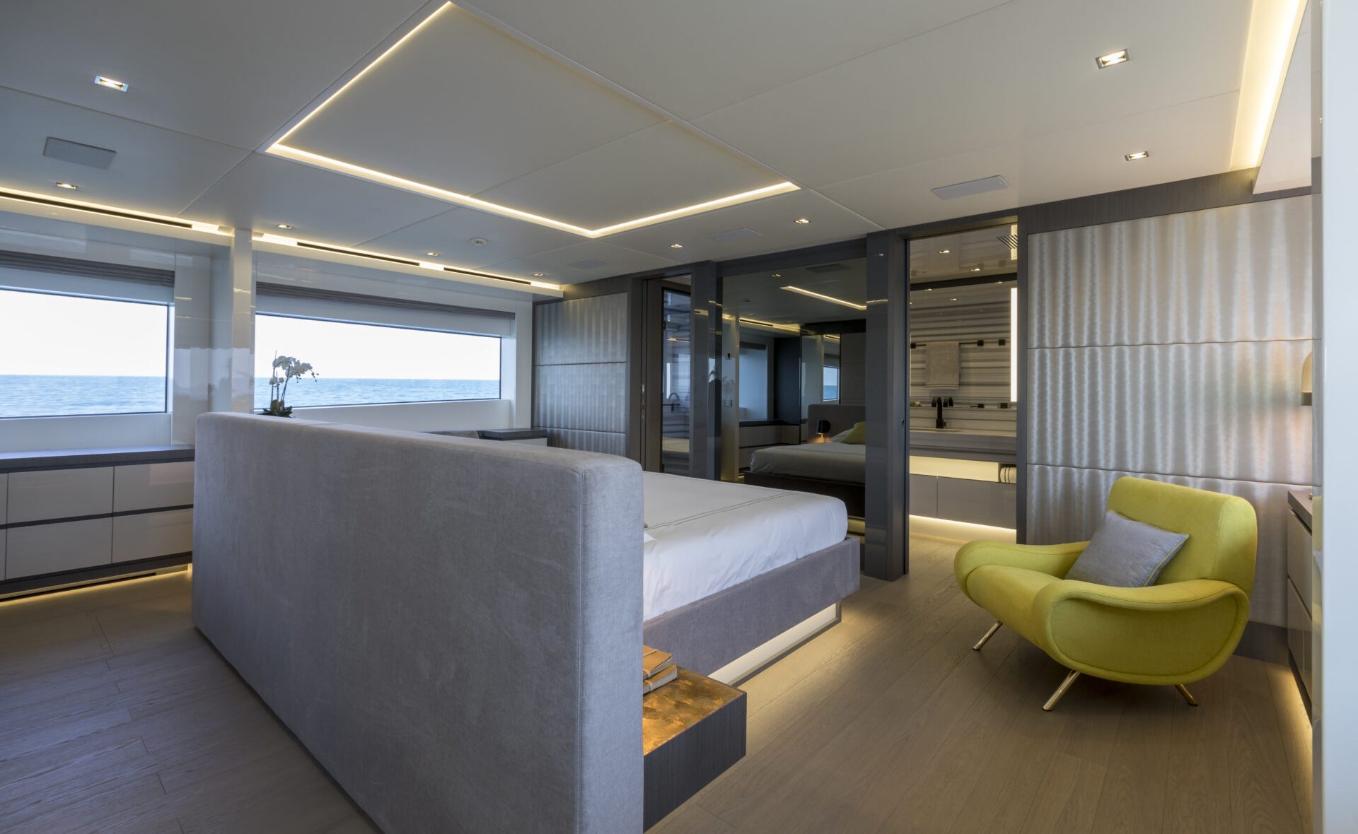 Luxury yacht bedroom with ocean view.