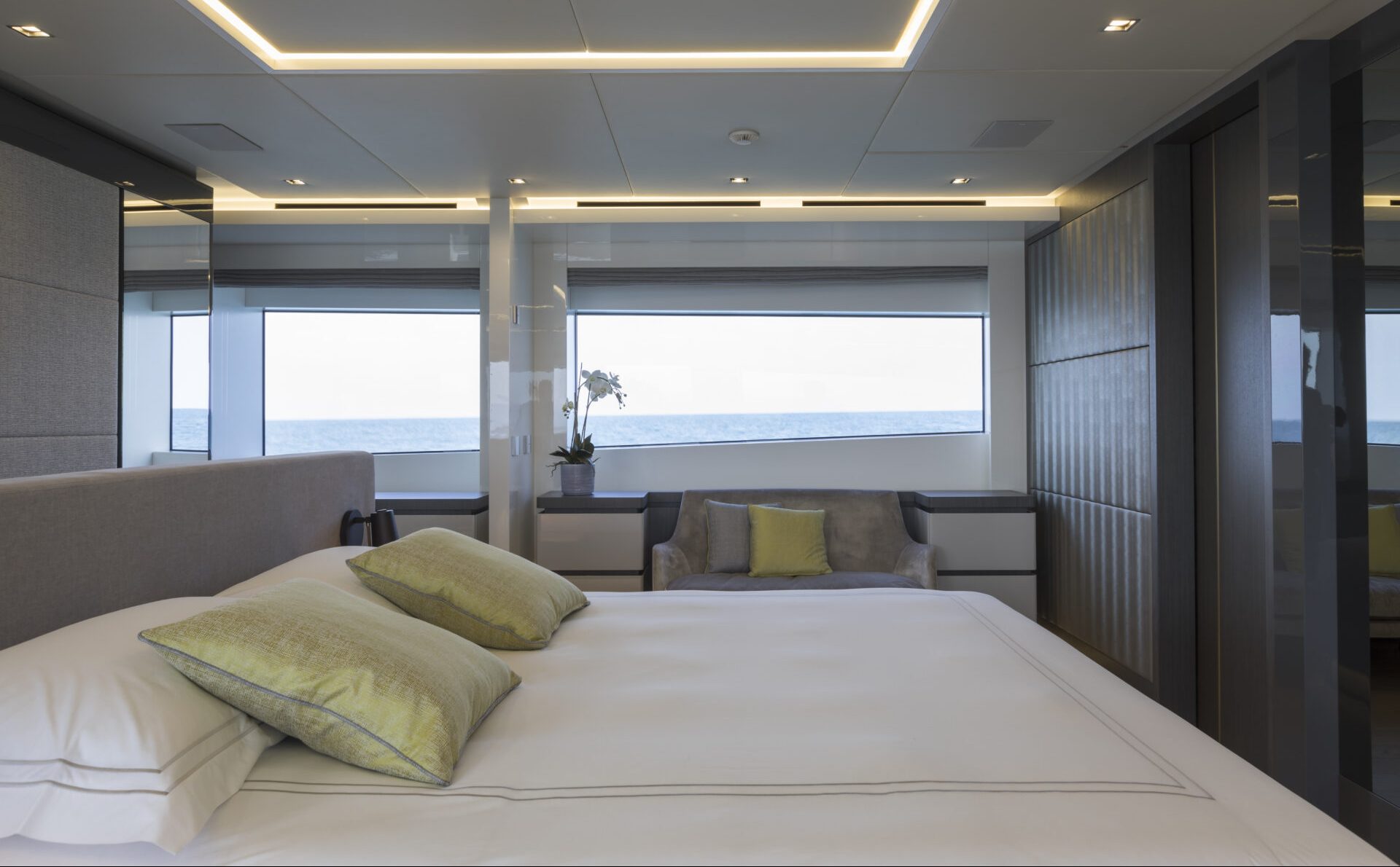 Luxurious yacht bedroom with ocean view.