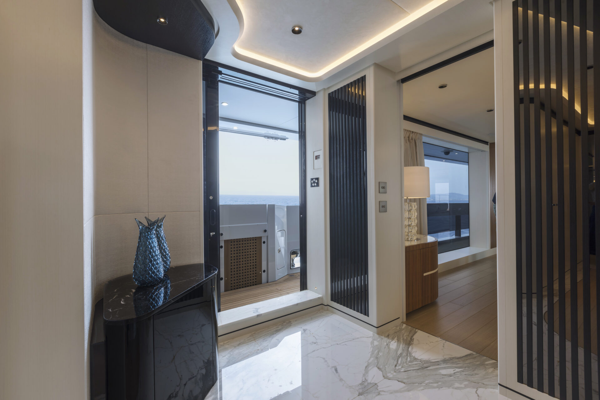 Luxurious yacht interior with ocean view and decor.