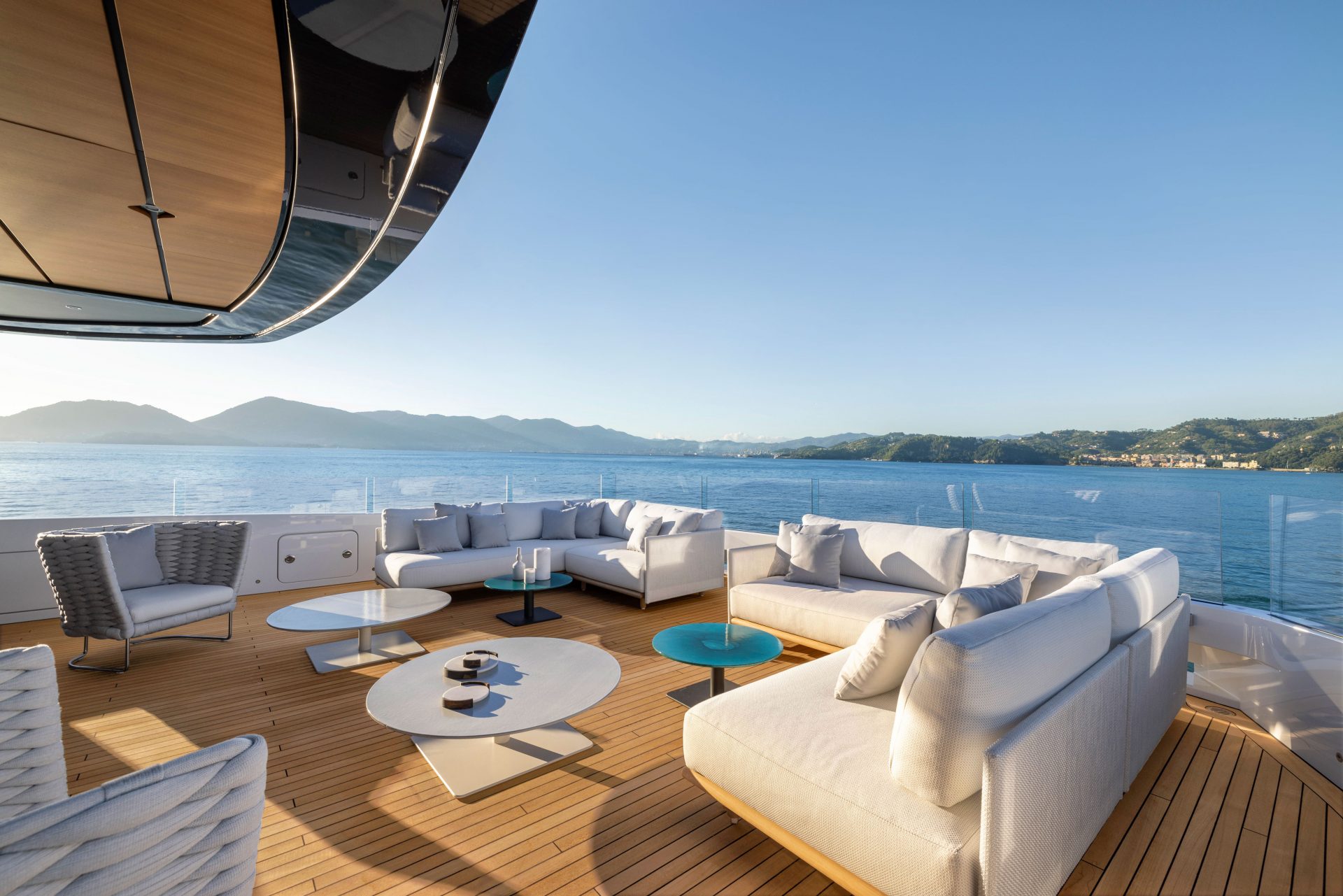 Luxury yacht deck with sofas and sea view