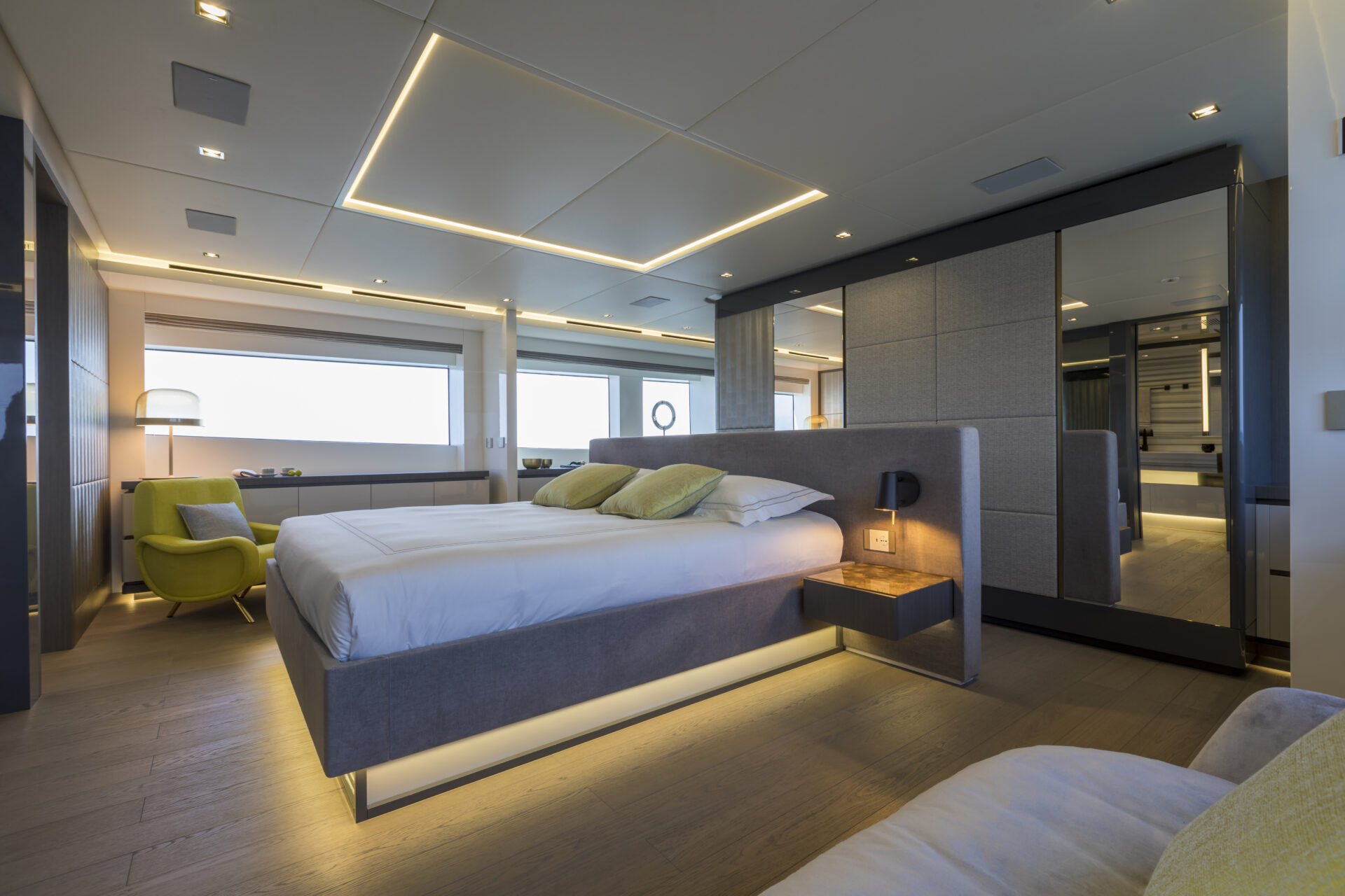 Luxury yacht bedroom with modern interior design.