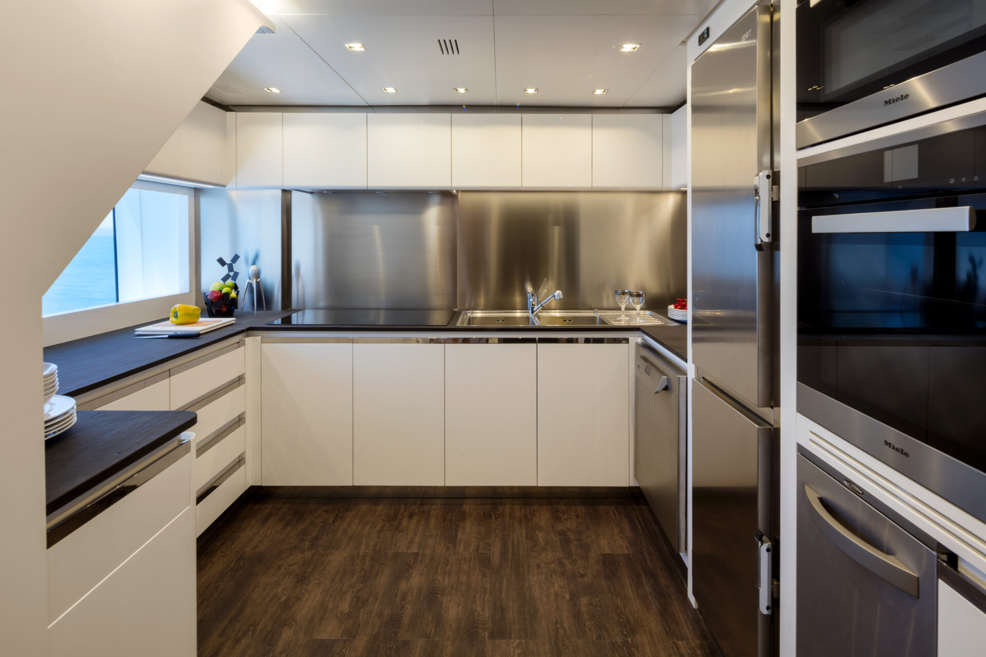 Modern yacht kitchen with stainless steel appliances
