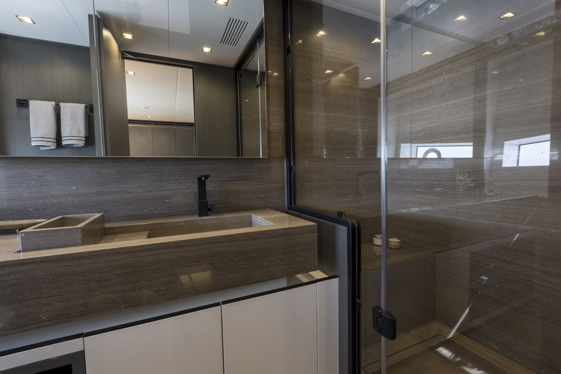 Luxurious yacht bathroom with marble finish.