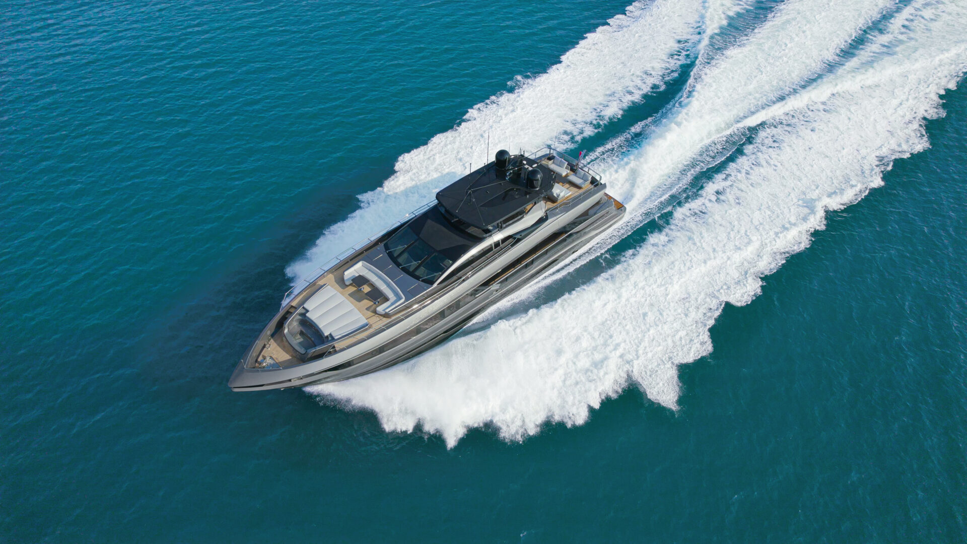 Mangusta yacht cruising on open blue sea