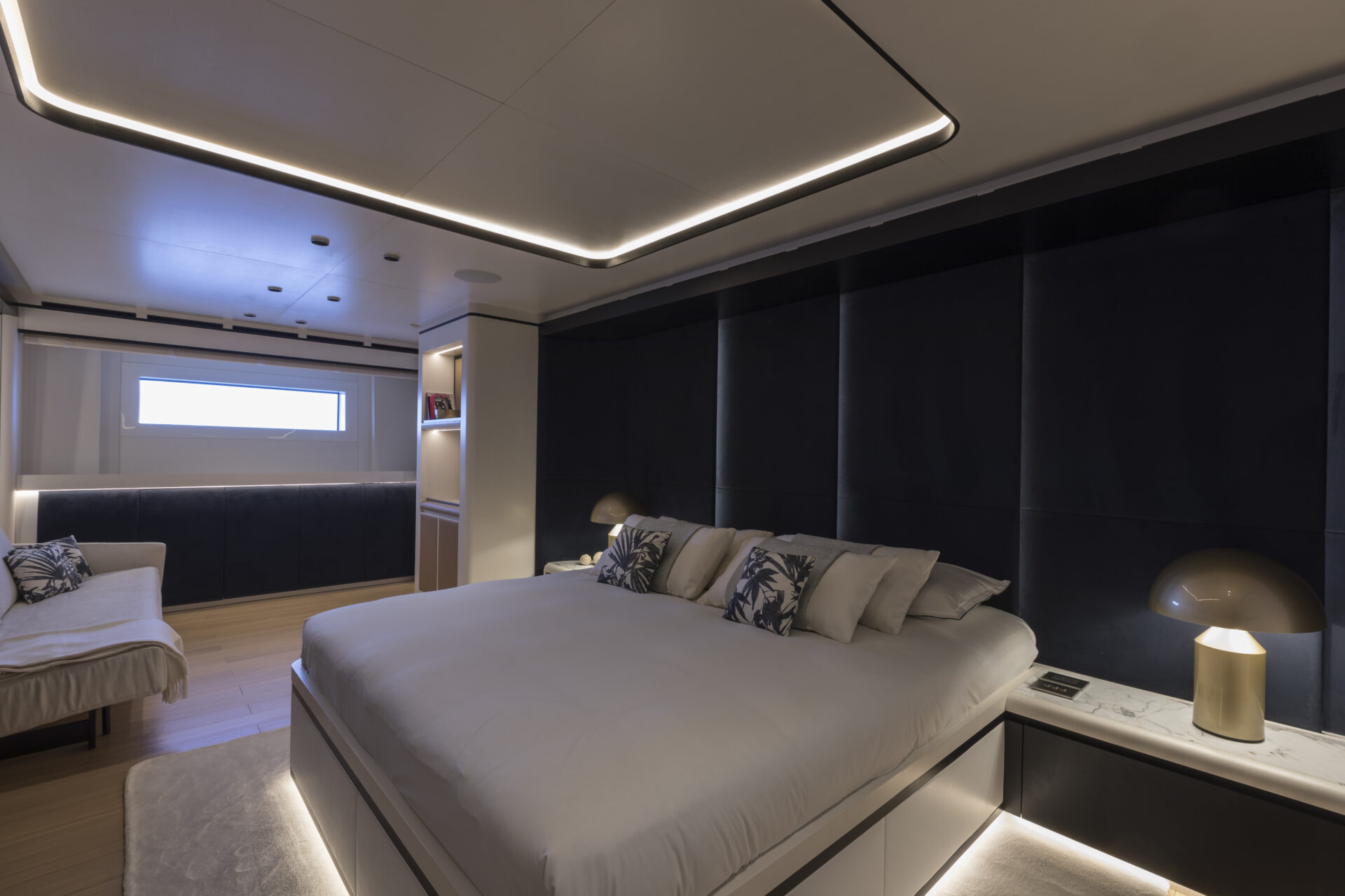 Luxury yacht master suite with modern furnishings.