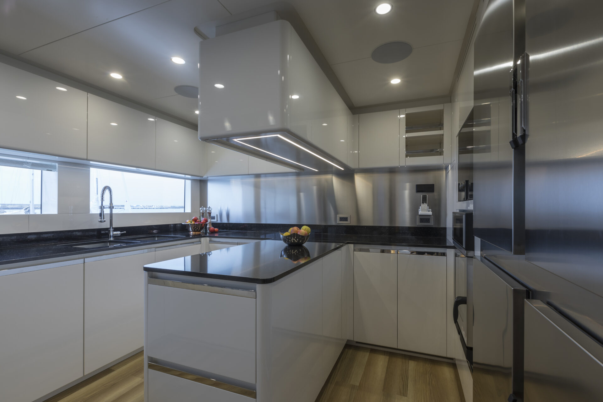 Modern yacht kitchen with sleek white cabinetry.