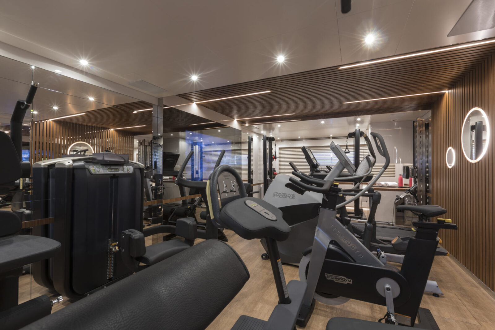 Yacht gym with Technogym equipment, elegant design