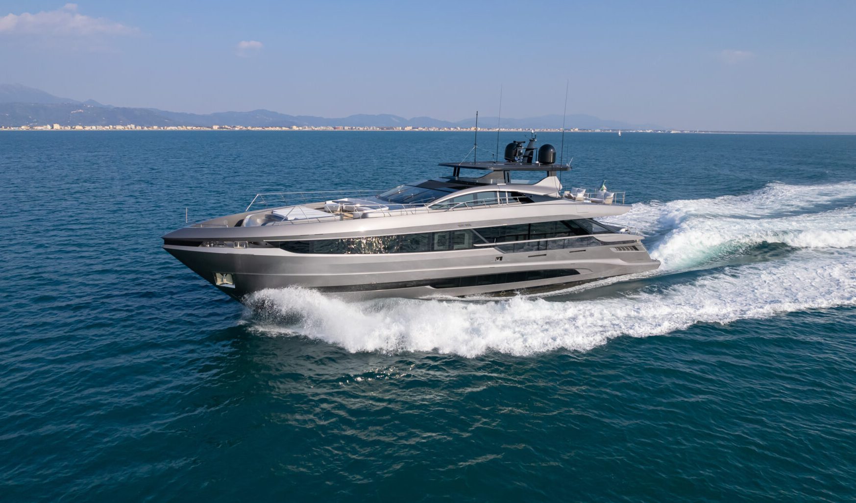 Mangusta yacht cruising on open sea.